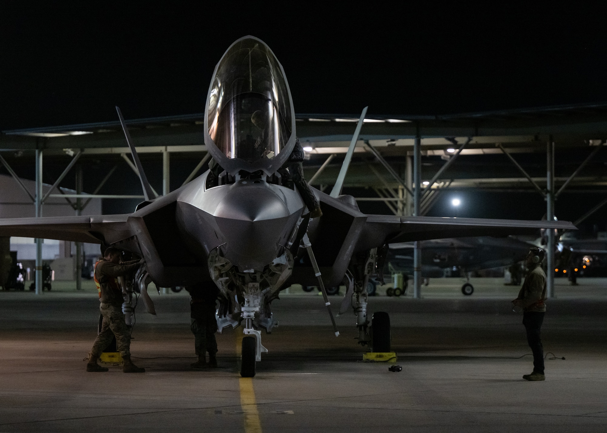 A photo of an F-35 crew preparing to deploy