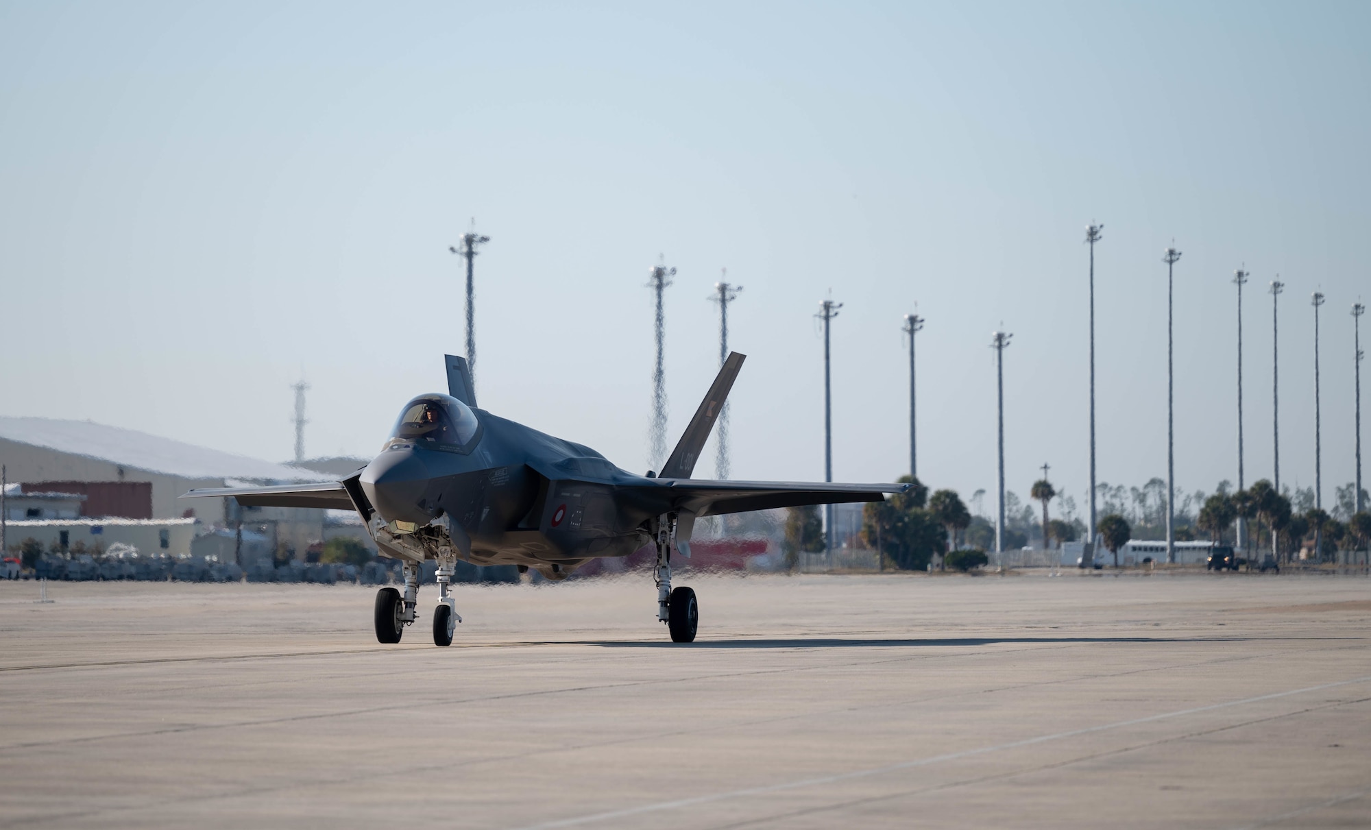 An F-35A Lightning II taxis on the flight line.