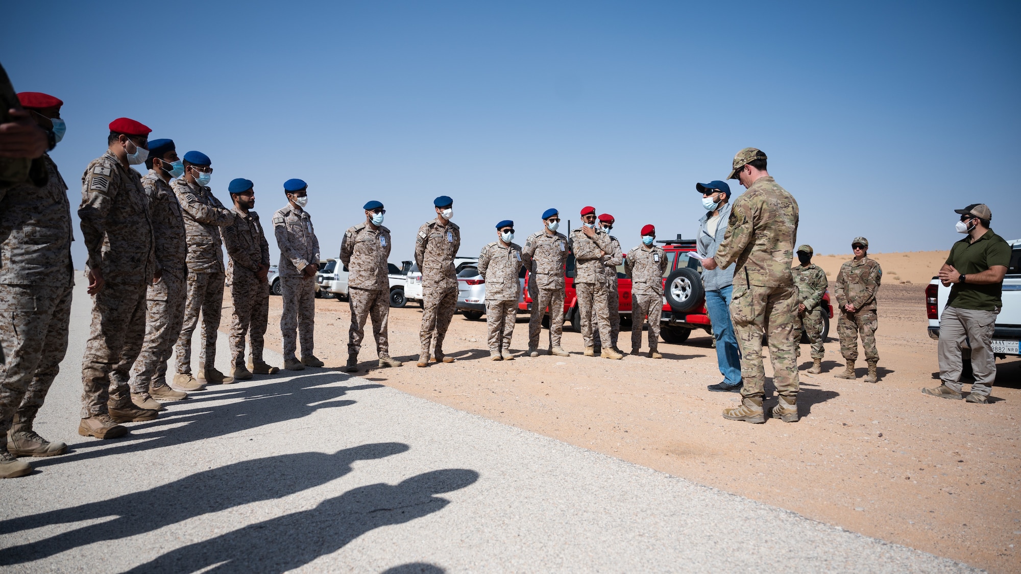 Staff Sgt. Jesse Seal, 378th Expeditionary Civil Engineer Squadron explosive ordnance disposal training section lead, gives a safety brief to members of the Royal Saudi Air Force during a combined training exercise at Prince Sultan Air Base, Kingdom of Saudi Arabia, Feb. 10, 2022. The bilateral exercise consisted of U.S. personnel from EOD and the Office of Special Investigation training alongside RSAF EOD and Intelligence and Security Wing personnel. (U.S. Air Force photo by Senior Airman Jacob B. Wrightsman)