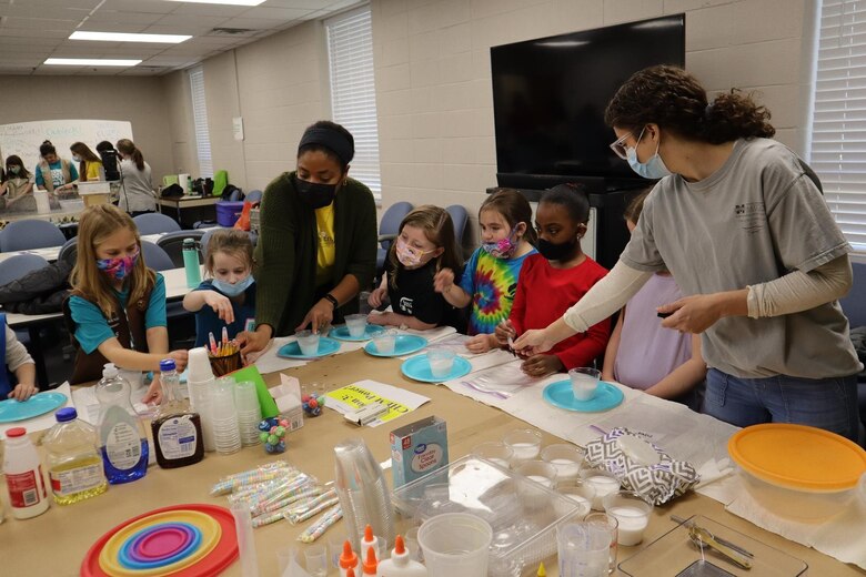 Nia Hurst (left) and McKinnsey Stanton from the U.S. Army Corps of Engineers Vicksburg District lead Girl Scouts in the CHEM power station.