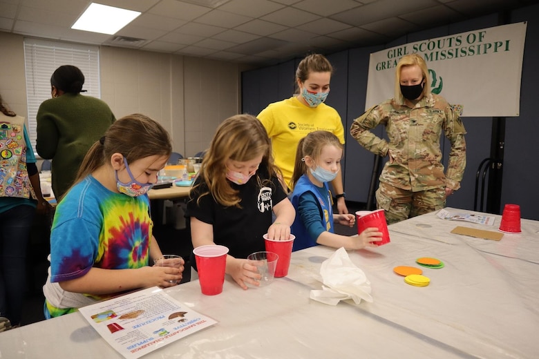 Col. Teresa Schlosser, 11th Commander of the ERDC, interacts with Girl Scouts at the soil stability station.