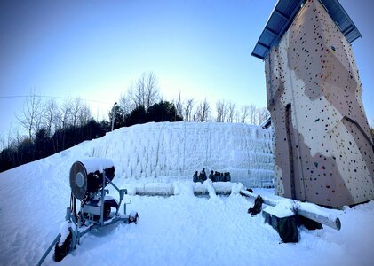 Students at the U.S. Army Mountain Warfare School’s Basic Military Mountaineer Course learn ice climbing techniques at the school’s ice climbing wall Jan. 21, 2022. The schoolhouse uses the same snow-making machine that commercial ski resorts use to keep the wall covered in ice.