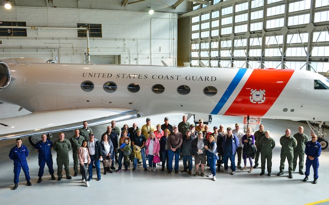 Coast Guard crewmembers and Vietnam veterans from the Coast Guard Cutter Owasco (WHEC-39), a 255-foot high endurance cutter, pose for a photo at Coast Guard Air Station Washington, Nov. 5, 2021. The veterans were given an air station tour and were presented with official lapel pins commemorating their service and for the 50th anniversary of the Vietnam War. (U.S. Coast Guard photo by Petty Officer 1st Class Tara Molle-Carr/Released)