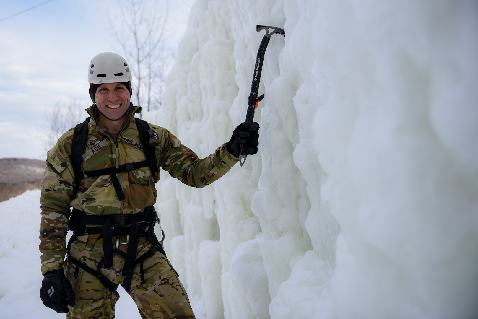 Sgt. 1st Class Nick Ash, an instructor at the U.S. Army Mountain Warfare School at Camp Ethan Allen Training Site, Vermont, at the school’s ice wall during the Advanced Military Mountaineer Course Jan. 23, 2022.
