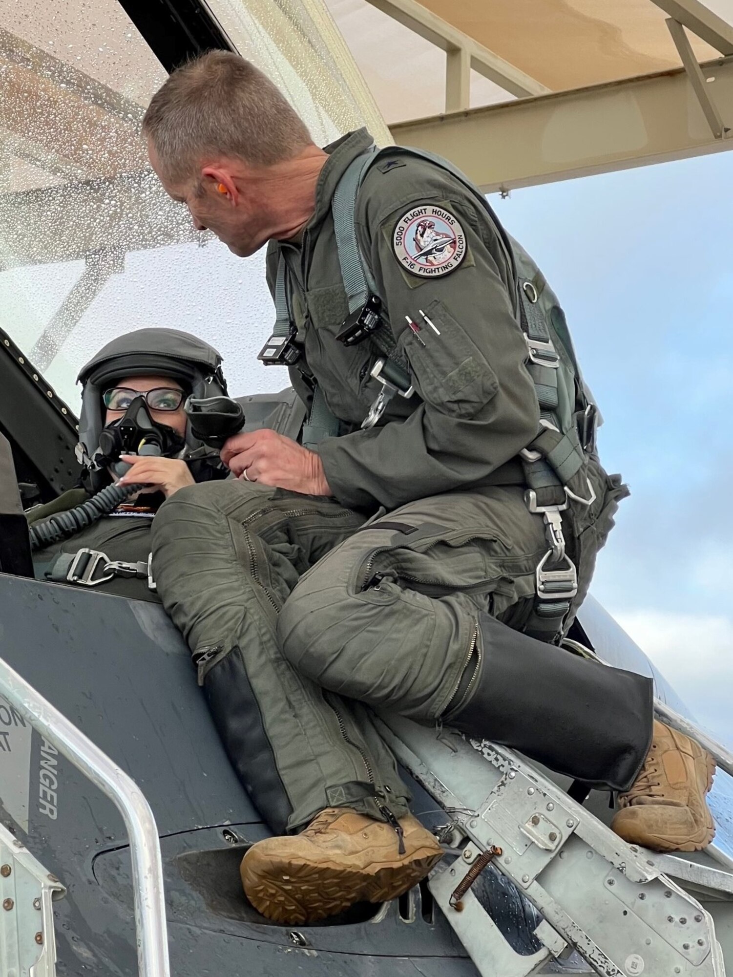 Brig. Gen. Jeffrey Butler, 162nd Wing Commander, prepares Danette Bewley, TAA President and Chief Executive Officer, for flight aboard an F-16. Orientation flights are sometimes conducted for civic leaders in order to ensure a better understanding of a particular weapons system and its role in the ANG mission. (Courtesy photo)