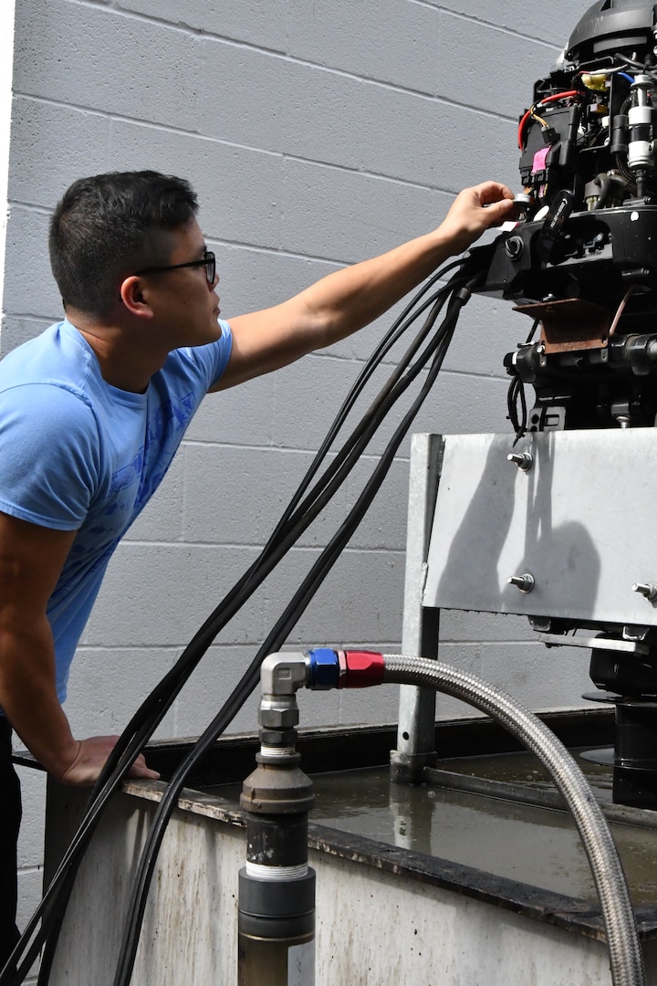 IMAGE: - Nhan Bui, a statistician with the High Power Microwave (HPM) Weapon Systems Division at Naval Surface Warfare Center Dahlgren Division, works on an HPM system. HPM is designed to be a safer alternative to other vessel stopping mitigations, using nonlethal methods. (U.S. Navy photo/Released)