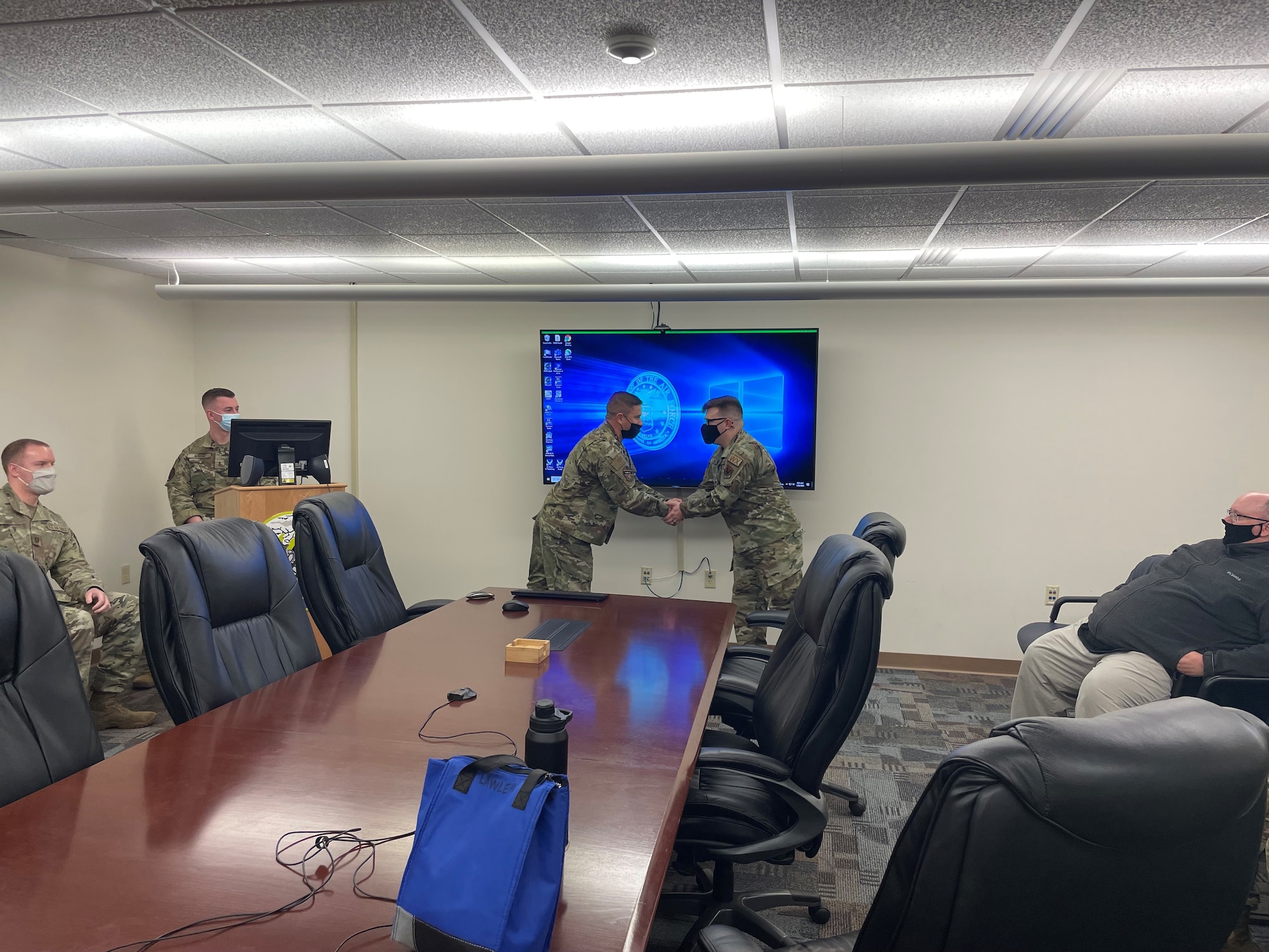 (Left to Right) Maj. Ricardo Cisneros (left), 18th Combat Weather Squadron Det. 4 commander, recognizes Staff Sgt. Jacob Lawler (right) from the 15th Operational Weather Squadron was recently recognized for his support during a ceremony on Jan. 26. (Courtesy Photo)