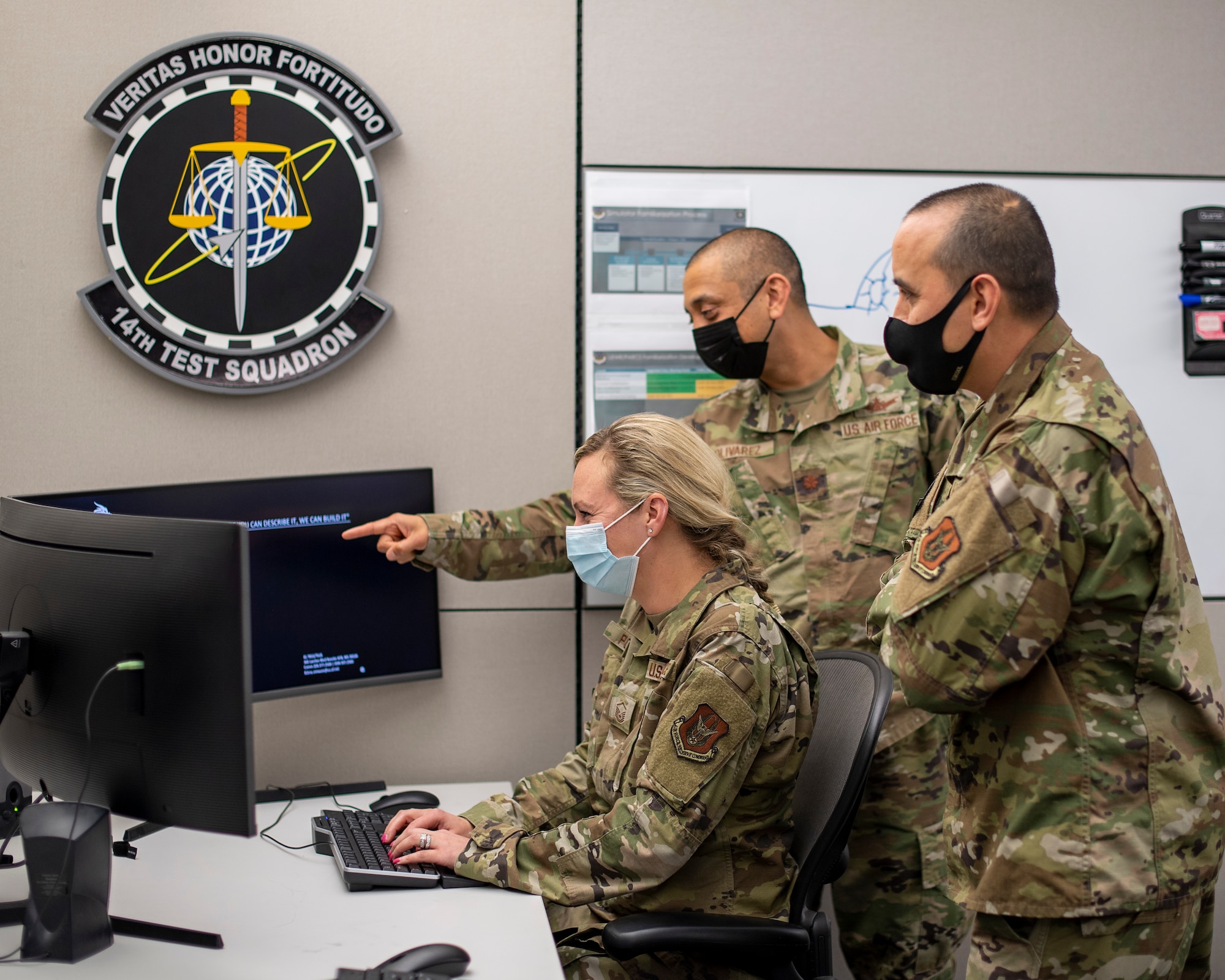 Lt Col. Richard Quinton, Maj. Ruben Olivarez and Master Sgt. Krystal Porter, 14th Test Squadron members, performs a cybersecurity assessment for the Space Fence Program, at Schriever Space Force Base, Colo. (U.S. Air Force Photo by Judi Tomich.)