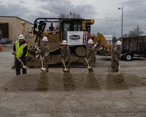 Joe Wambheim, LS Black Project Manager, U.S. Air Force Col. Chistopher Schlak, 509th Mission Support Group Commander, U.S. Army Col. Travis Rayfield, US Army Corps of Engineers Kansas City District Commander, U.S. Air Force Col. Daniel Diehl, 509th Bomb Wing Commander, and U.S. Air Force Maj. Joshua Anson break ground at the site of the new Vehicle Maintainence Facility on Whiteman Air Force Base, Mo. Feb. 16, 2022. The planned 58,000 square-foot project will be 20,000 sqaure-feet larger than the current facility and will help increase squadron readiness and efficiency. (U.S. Air Force photo by Airman 1st Class Bryson Britt)