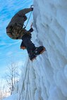 Staff Sgt. Sherron Murphy, a student at the U.S. Army Mountain Warfare School’s Basic Military Mountaineer Course, practices ice climbing Jan. 21, 2022. The AMWS is a U.S. Army Training and Doctrine Command school operated by the Vermont Army National Guard at Camp Ethan Allen Training Site, Vermont.