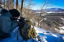 Cadet Elizabeth Carney, a student at the U.S. Army Mountain Warfare School’s Basic Military Mountaineer Course, shoots at a high-angle range Jan. 24, 2022. The school teaches basic, advanced and specialty mountain warfare courses to U.S. and foreign service members.