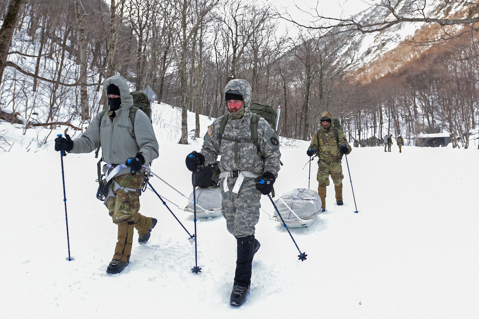 Students at the U.S. Army Mountain Warfare School’s Advanced Military Mountaineer Course in Jericho, Vermont, drag mountaineering equipment on sleds as they leave the site where they camped in temperatures that plunged to -29 degrees with windchill Jan. 27, 2022.