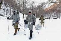 Students at the U.S. Army Mountain Warfare School’s Advanced Military Mountaineer Course in Jericho, Vermont, drag mountaineering equipment on sleds as they leave the site where they camped in temperatures that plunged to -29 degrees with windchill Jan. 27, 2022.