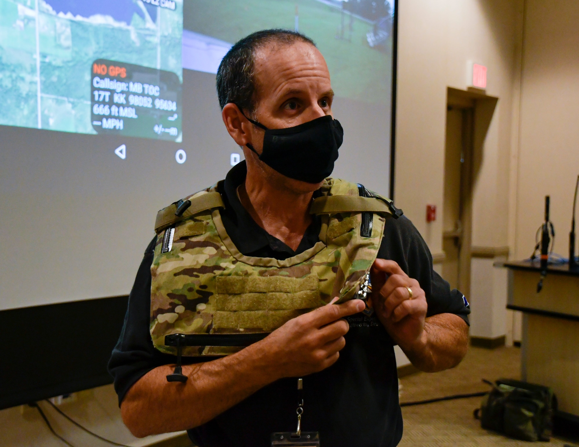Robert Denton, manager for the Multi-Antenna Communications and Wearables Program, performs a demonstration with wearable antenna gear during an innovation brief at Alpena Combat Readiness Training Center, Michigan, Aug. 5, 2021.