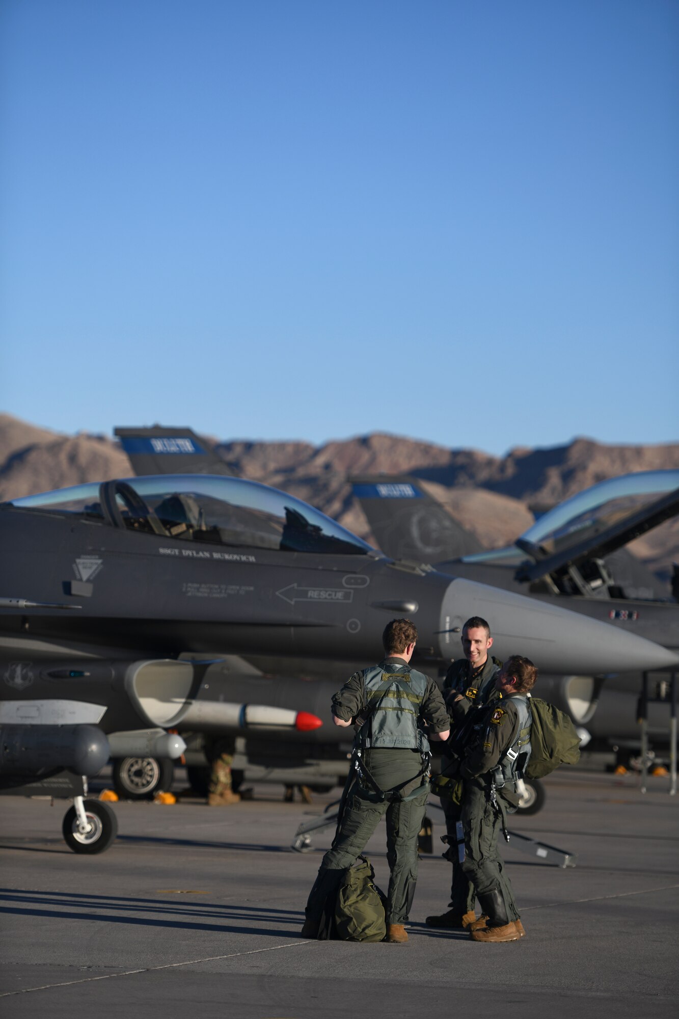 U.S. Air Force F-16 Fighting Falcon pilots assigned to the 148th Fighter Wing, Minnesota Air National Guard, Duluth, Minn., gather after a day-time training mission during Red Flag-Nellis 22-1, Nellis Air Force Base, Nev., Feb 8, 2022.