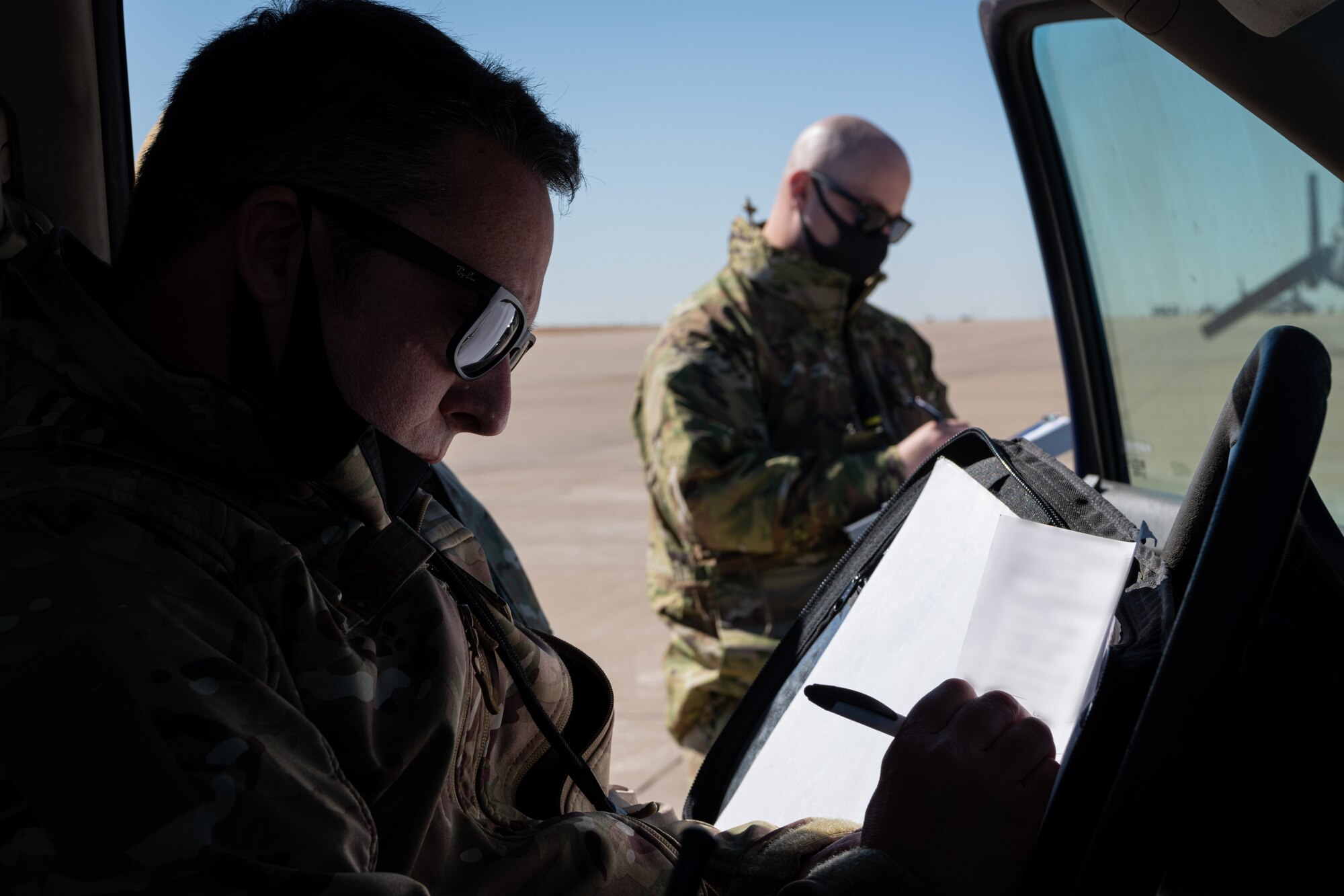 A U.S. Airman fills out paperwork.