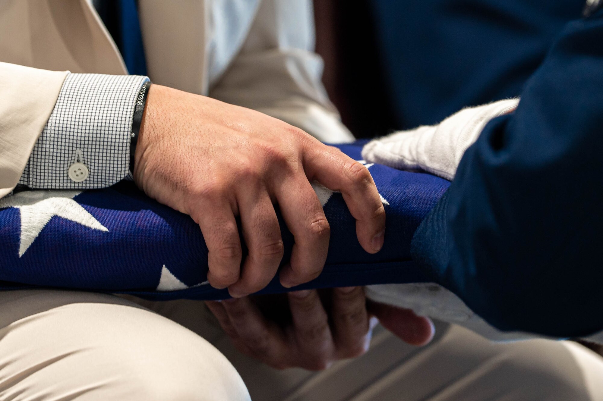 Man receives folded flag.