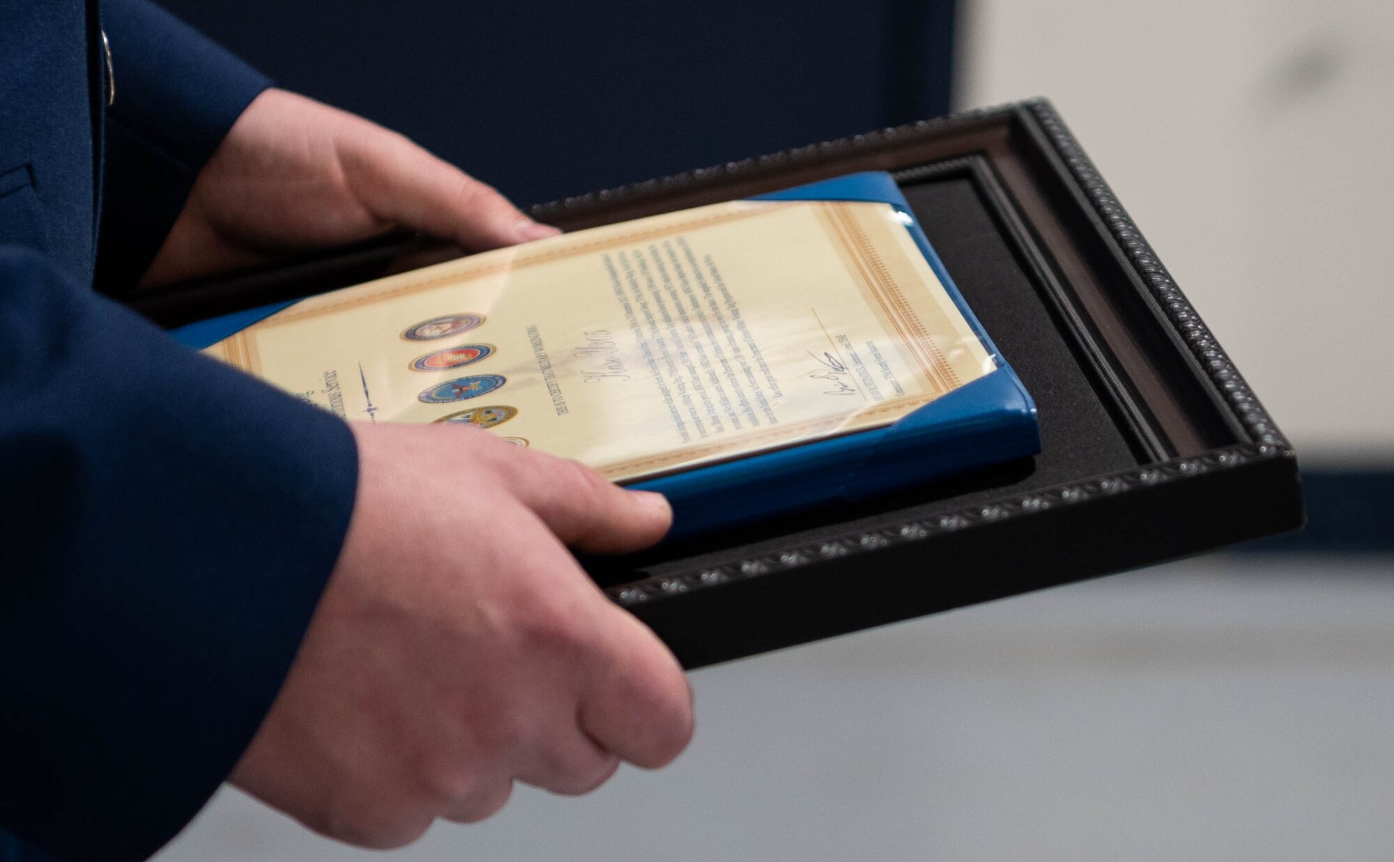 Airman holds certificate.