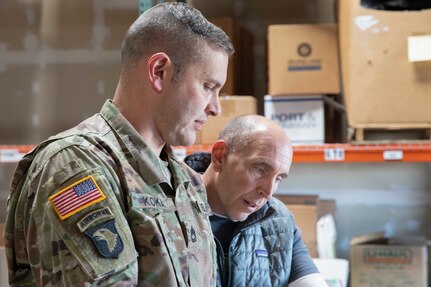 A soldier talks to a civilian