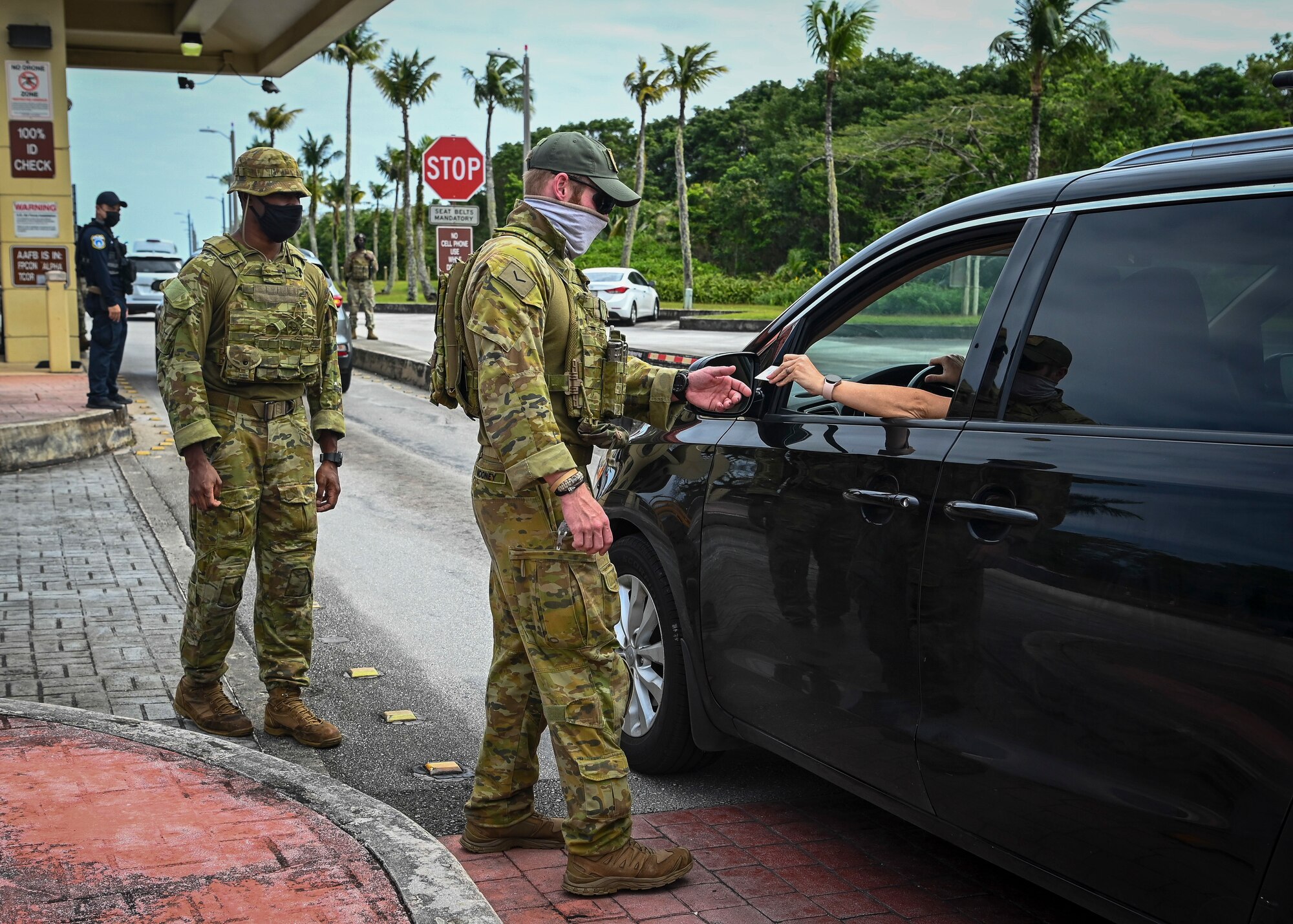 Royal Australian Air Force personnel conduct an identification card check at Arc Light Gate during Cope North 22 on Andersen Air Force Base, Guam, Feb. 15, 2022.