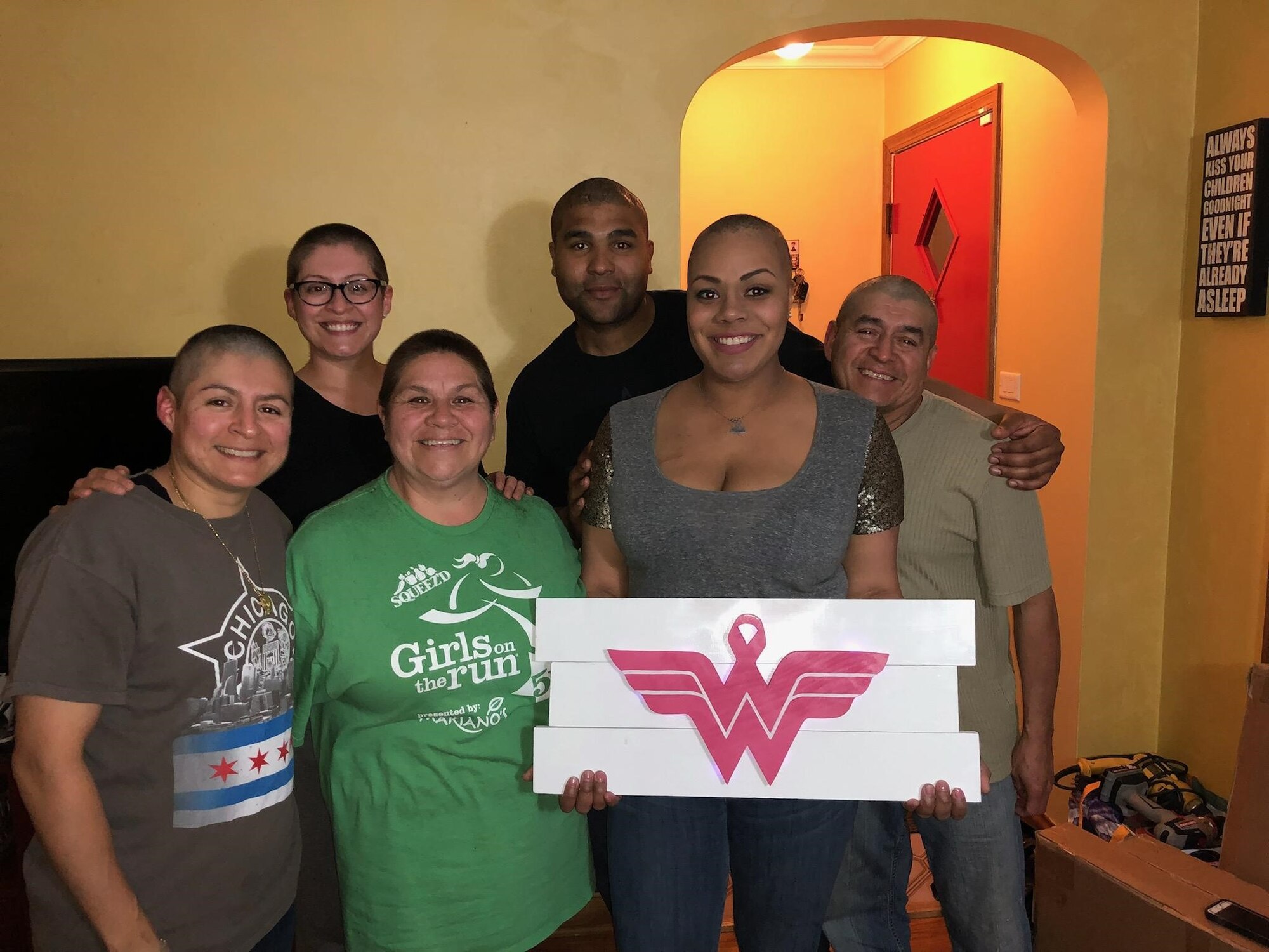 Martinez-Fernandez family supports Ashley by shaving their heads after her hair loss began due to the chemotherapy treatments.