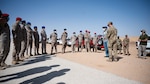 Staff Sgt. Jesse Seal, 378th Expeditionary Civil Engineer Squadron explosive ordnance disposal training section lead, gives a safety brief to members of the Royal Saudi Air Force during a combined training exercise at Prince Sultan Air Base, Kingdom of Saudi Arabia, Feb. 10, 2022. The bilateral exercise consisted of U.S. personnel from EOD and the Office of Special Investigation training alongside RSAF EOD and Intelligence and Security Wing personnel. (U.S. Air Force photo by Senior Airman Jacob B. Wrightsman)