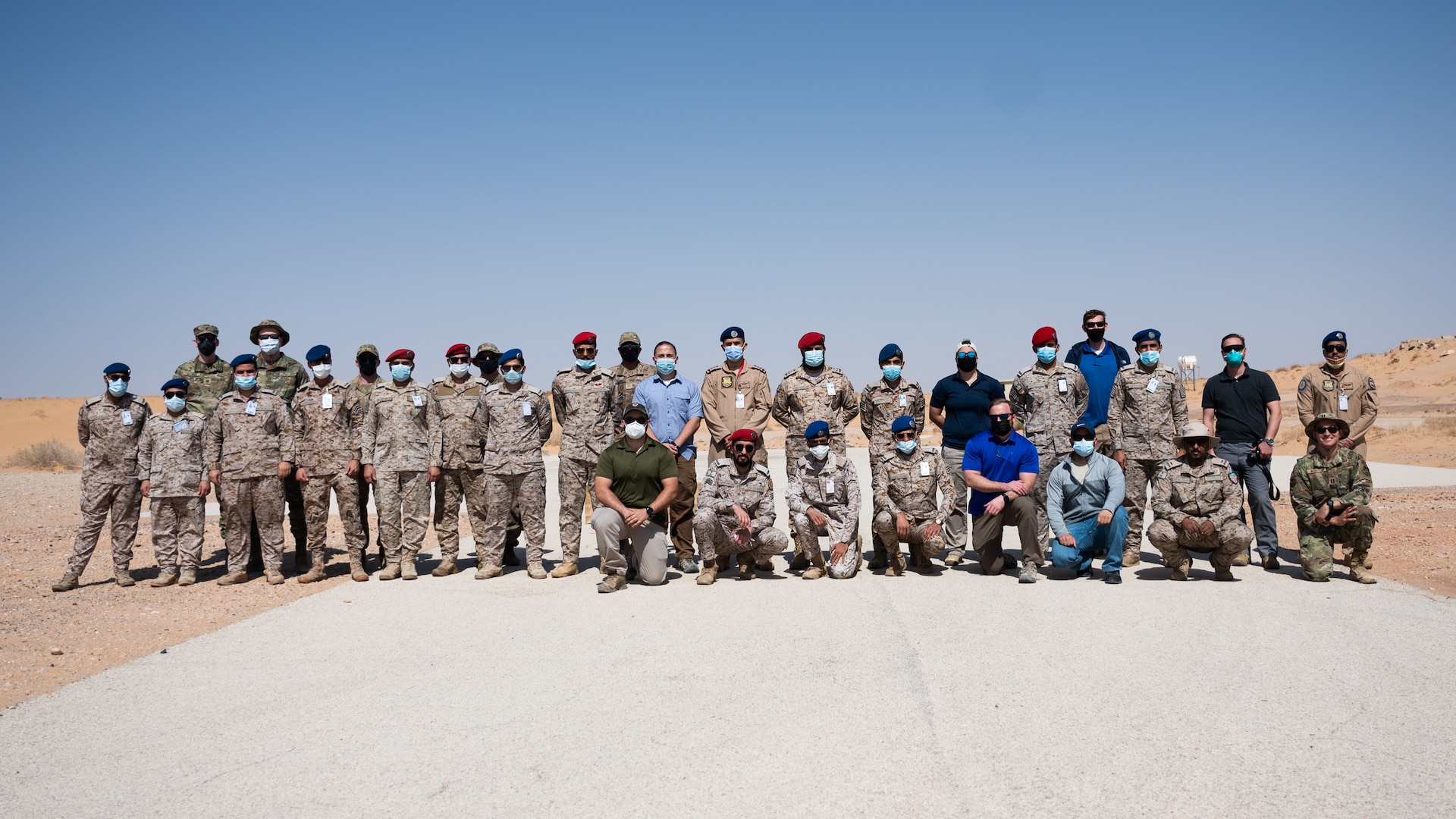 Service members from the Royal Saudi Air Force and the U.S. Air Force pose for a photo after a bilateral training exercise at Prince Sultan Air Base, Kingdom of Saudi Arabia, Feb. 10, 2022. The bilateral exercise consisted of U.S. personnel from the explosive ordnance disposal team and the Office of Special Investigation training alongside RSAF EOD and Intelligence and Security Wing personnel. (U.S. Air Force photo by Senior Airman Jacob B. Wrightsman)