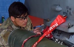 Staff Sgt. Wesley Curfman, 433rd Civil Engineer Squadron explosive ordnance disposal journeyman, disarms a triple ejection rack on a 149th Fighter Wing F-16 Fighting Falcon during an aircraft familiarization exercise at Joint Base San Antonio-Lackland, Texas, Feb. 10, 2022. (U.S. Air Force photo by Airman Mark Colmenares)