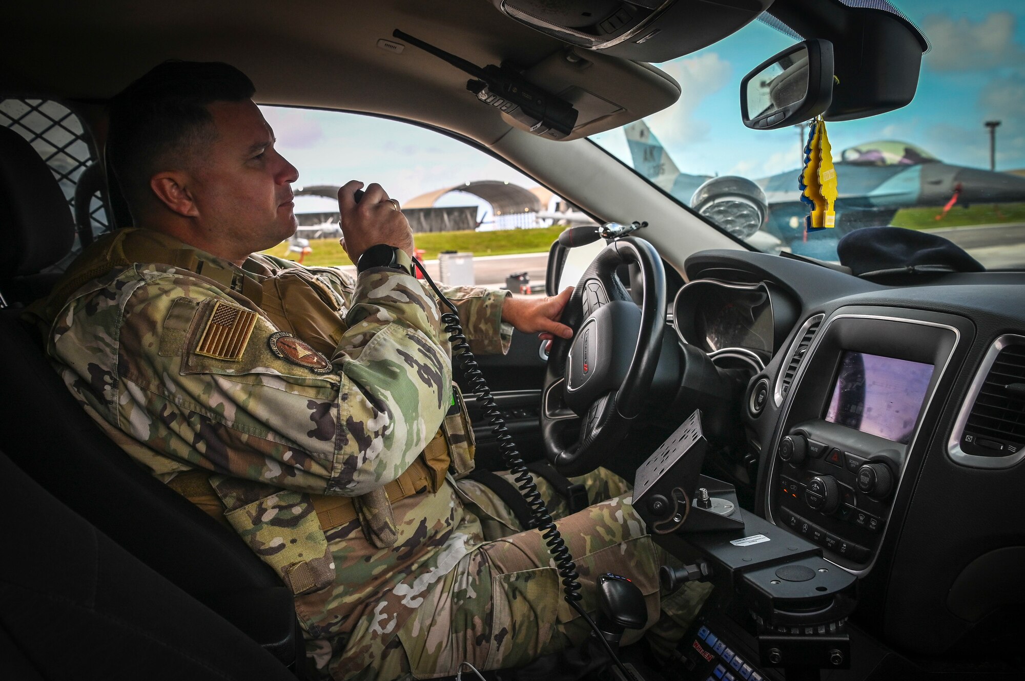 U.S. Air Force Tech. Sgt. Matthew Napatui, assigned to the 254th Security Forces Squadron, provides flight line security during exercise Cope North 22 on Andersen Air Base, Guam, Feb. 14, 2022.