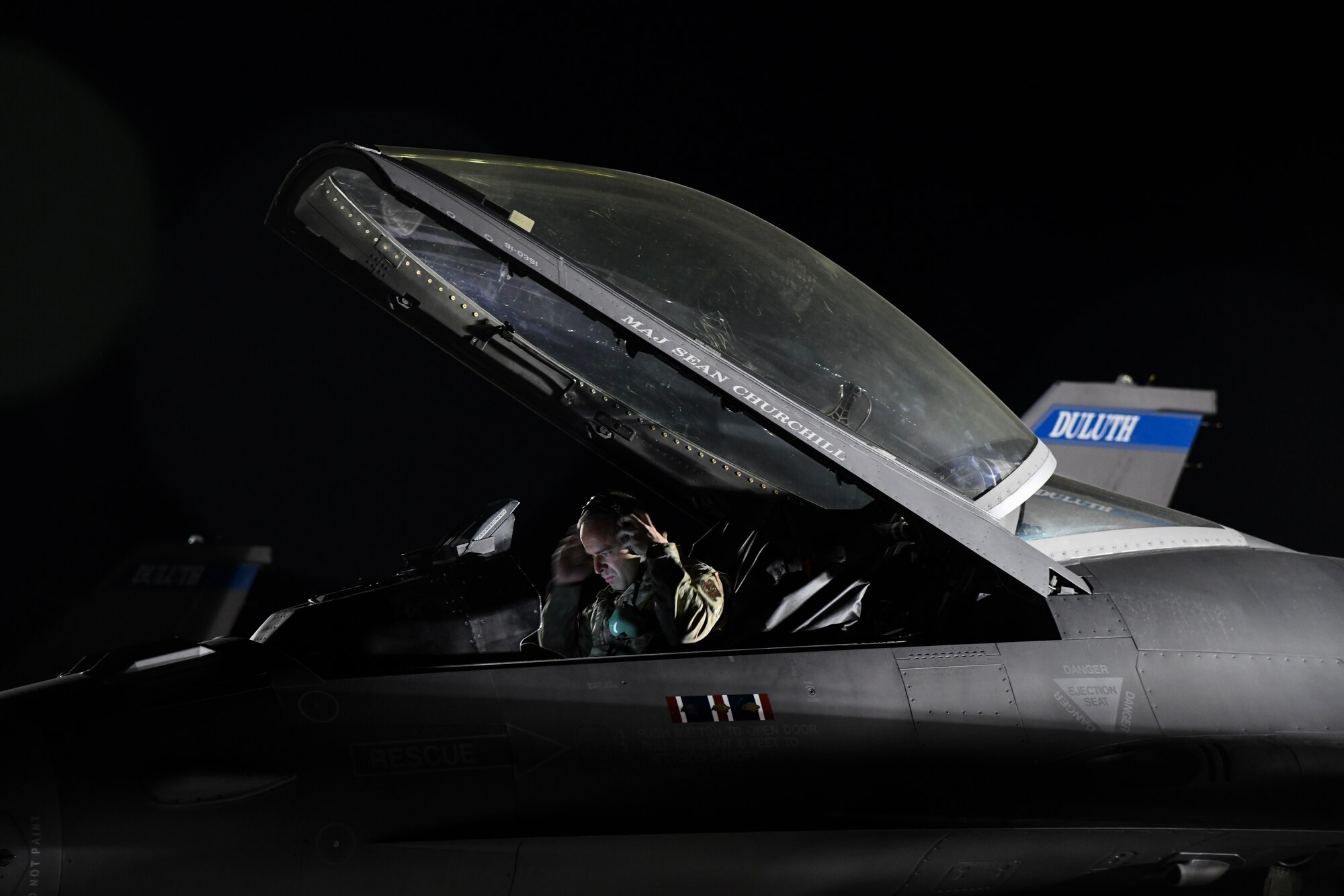 A U.S. Air Force Crew Chief, Minnesota Air National Guard, Duluth, Minn., performs routine maintenance on a Block 50 F-16CM Fighting Falcon at Nellis Air Force Base, Nev., Feb 8, 2022.