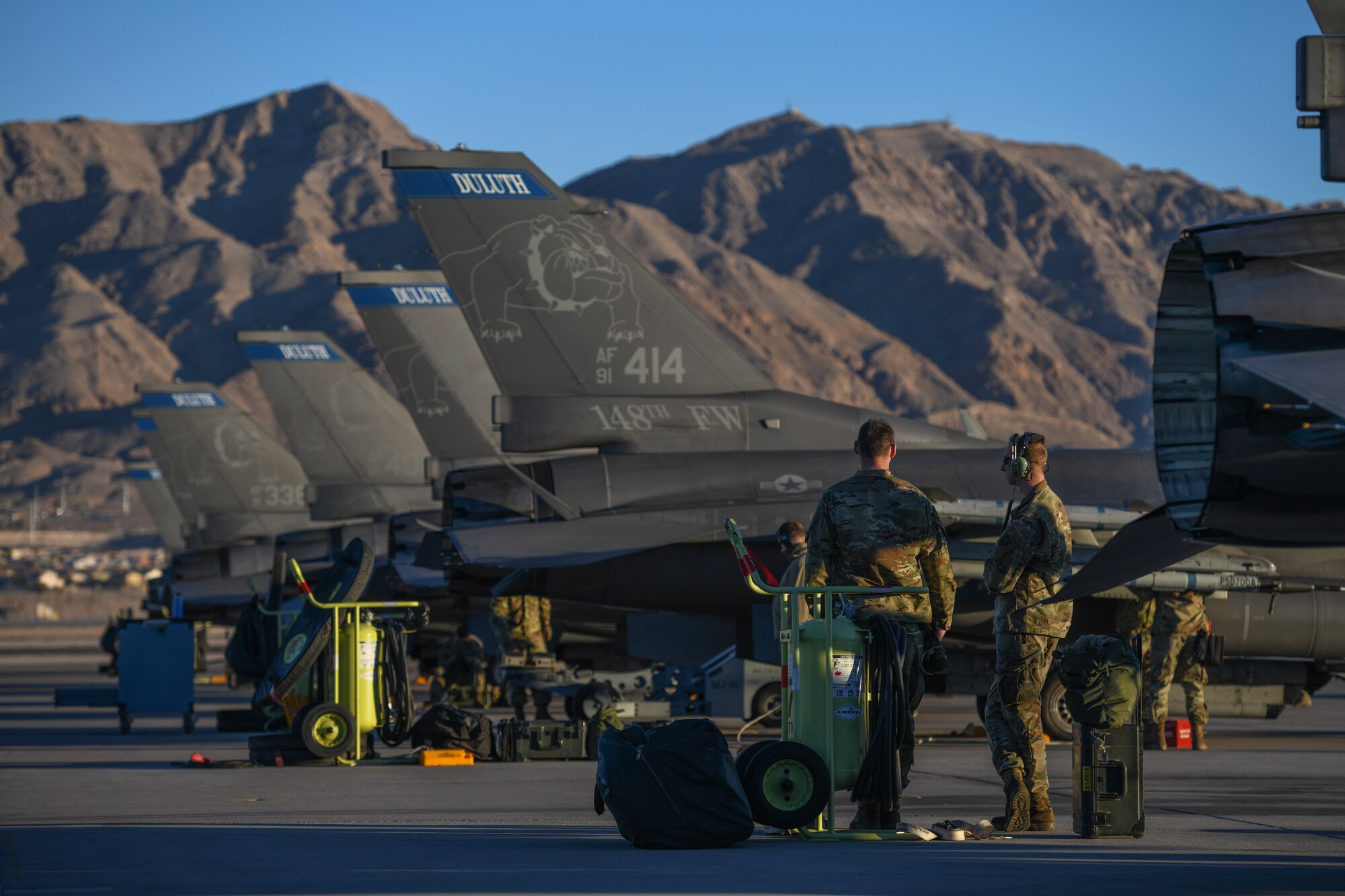 U.S. Air Force F-16 Crew Chiefs assigned to the 148th Fighter Wing, Minnesota Air National Guard, Duluth, Minn., perform maintenance on Block 50 F-16CM Fighting Falcons after returning from a training exercise at Nellis Air Force Base, Nev., Feb 8, 2022, during participation in Red Flag Nellis 22-1.