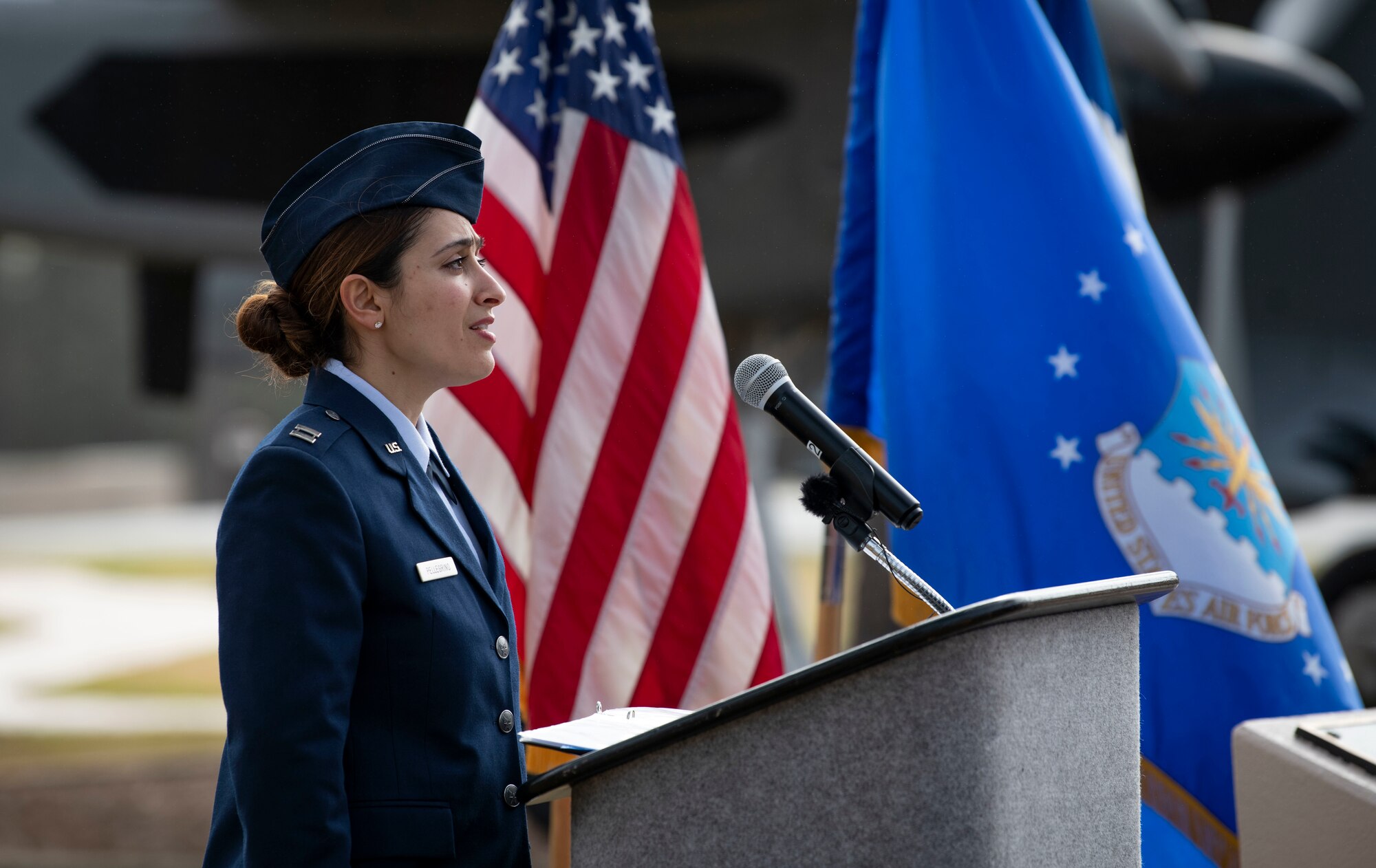 U.S. Air Force Capt. Cristina Pellegrino, 319th Special Operations Squadron, sings the National Anthem during a memorial ceremony at Hurlburt Field, Florida, Feb. 17, 2022.