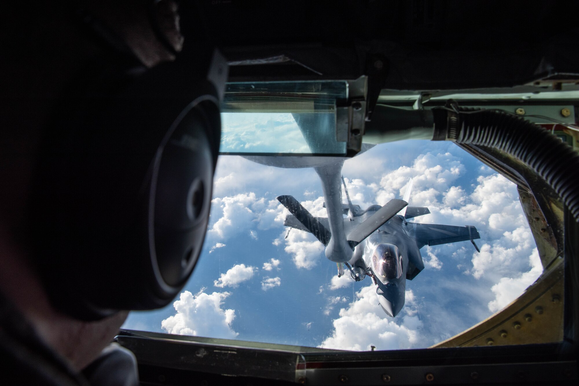 An Airman flies the boom on an aircraft.