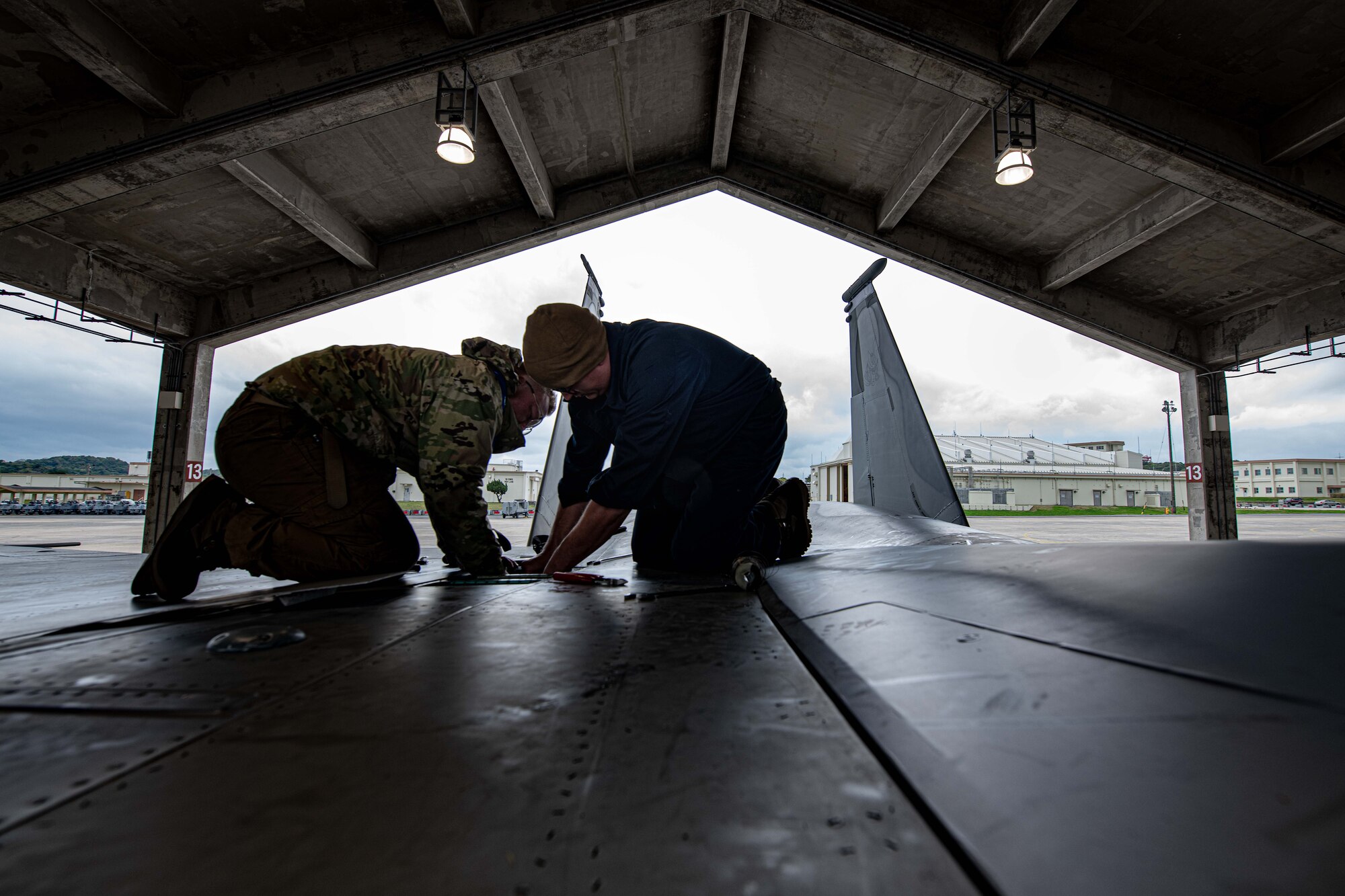 Maintainers check an F-15.