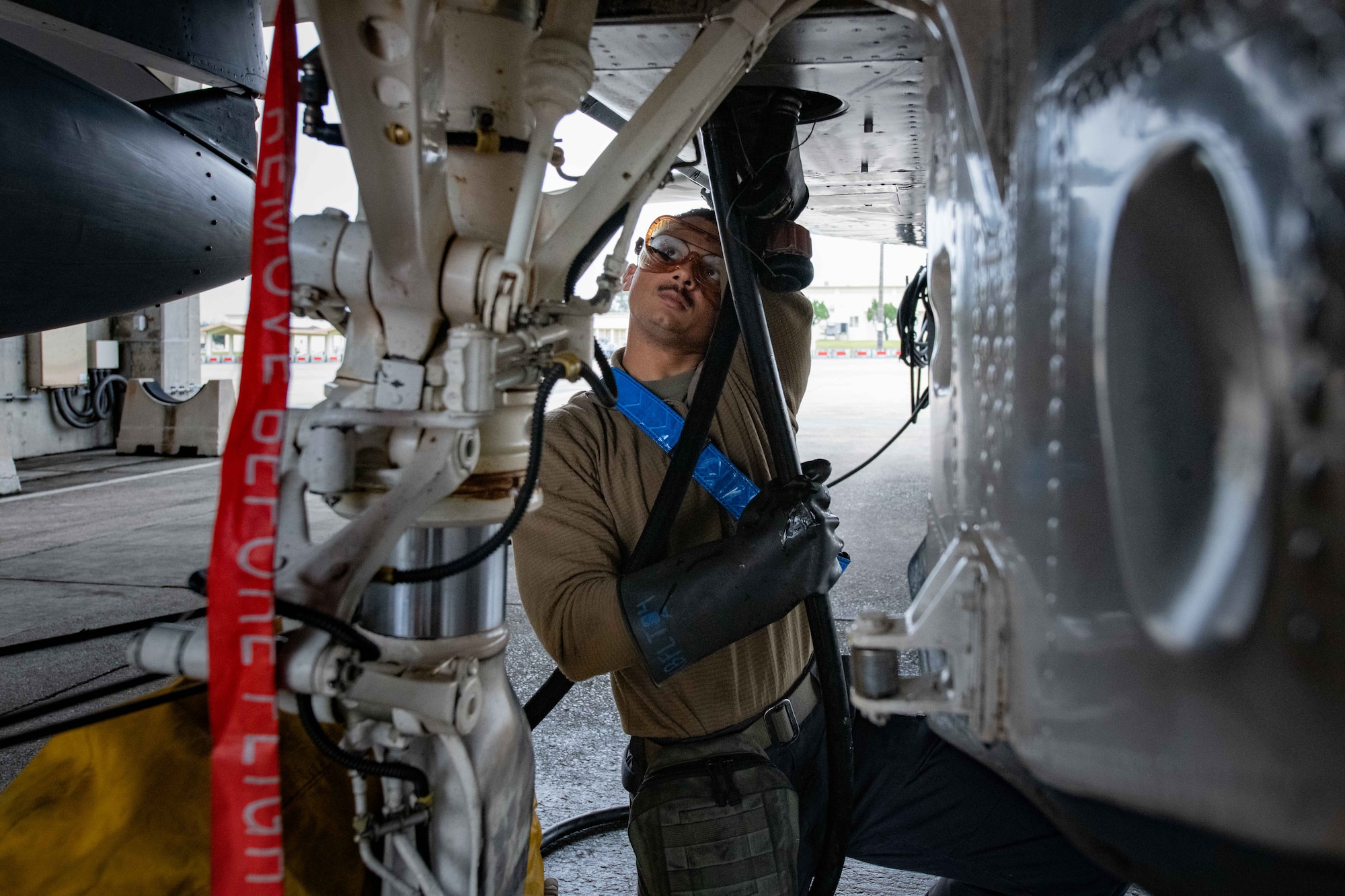 A maintainer checks F-15