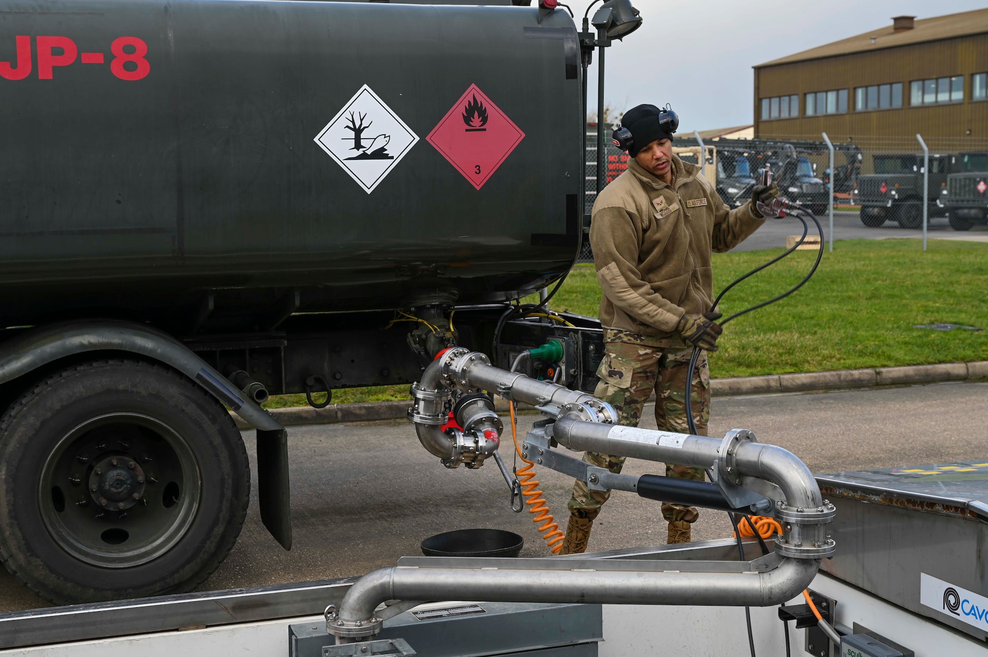U.S. Air Force Airmen assigned to the 100th Logistics Readiness Squadron monitor fuel pressure in an R-11 fuel truck at Royal Air Force Mildenhall, England, Feb. 17, 2022.  Fuel pressure critically affects fuel flow, from truck to aircraft. (U.S. Air Force photo by Airman 1st Class Viviam Chiu)