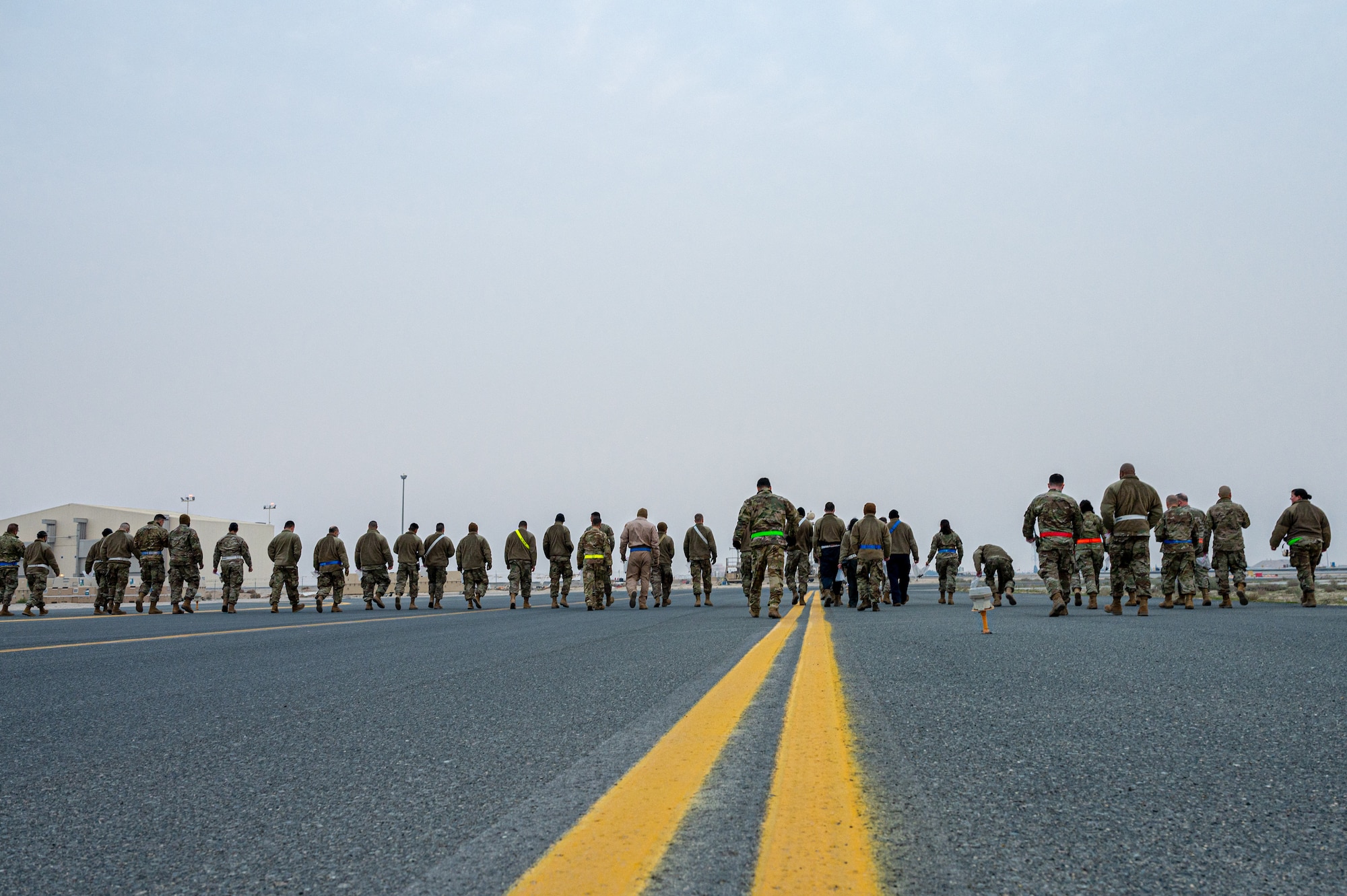 Airmen from the 386th Expeditionary Maintenance Group, including some from the 407th Expeditionary Operations Support Squadron, conduct FOD walks weekly.