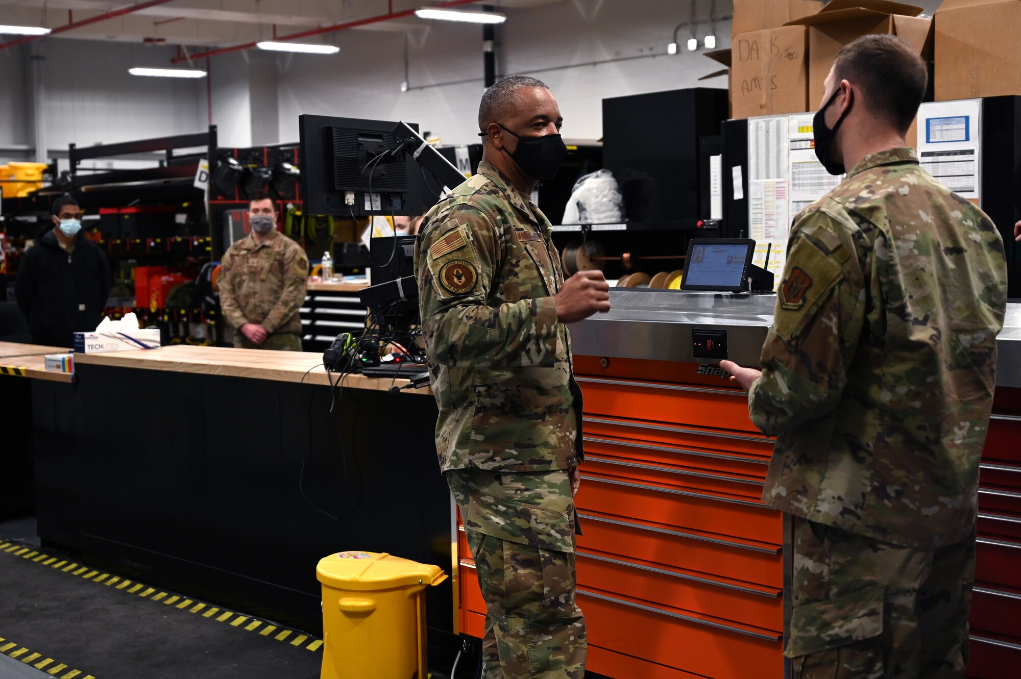 Chief Master Sgt. Timothy C. White, the Air Force Reserve Command Chief, speaks with Senior Master Sgt. Joseph R. Davis, 911th Maintenance Squadron sheet metal technician, at the Pittsburgh International Airport Air Reserve Station, Pennsylvania, Jan. 8, 2022.