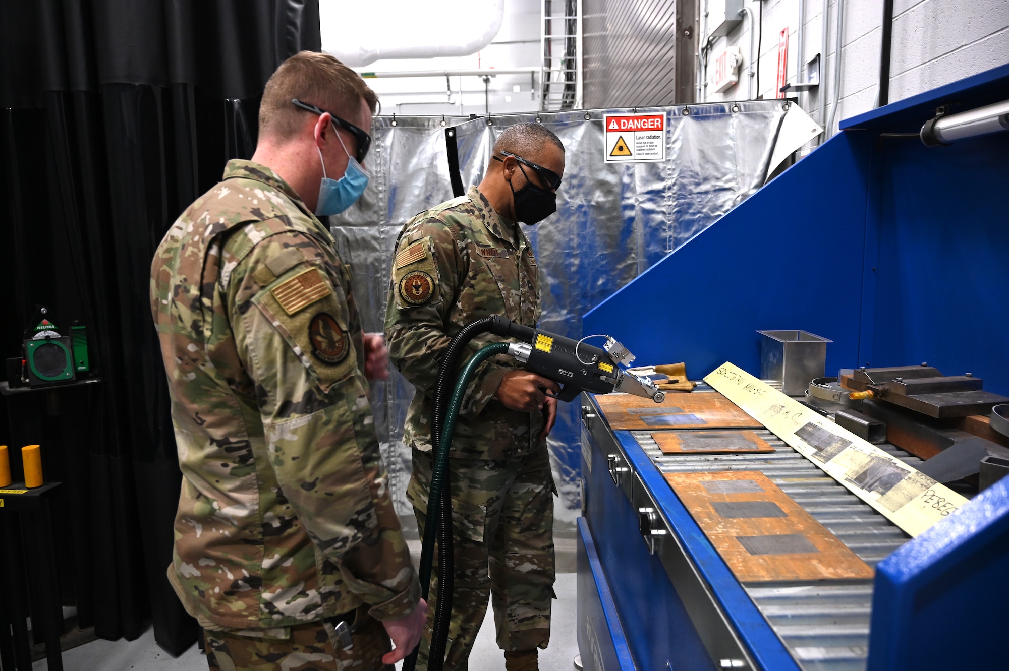 Chief Master Sgt. Timothy C. White, the Air Force Reserve Command Chief, receives instruction from Master Sgt. Michael J. Howard, 911th Maintenance Squadron sheet metal technician, at the Pittsburgh International Airport Air Reserve Station, Pennsylvania, Jan. 8, 2022.