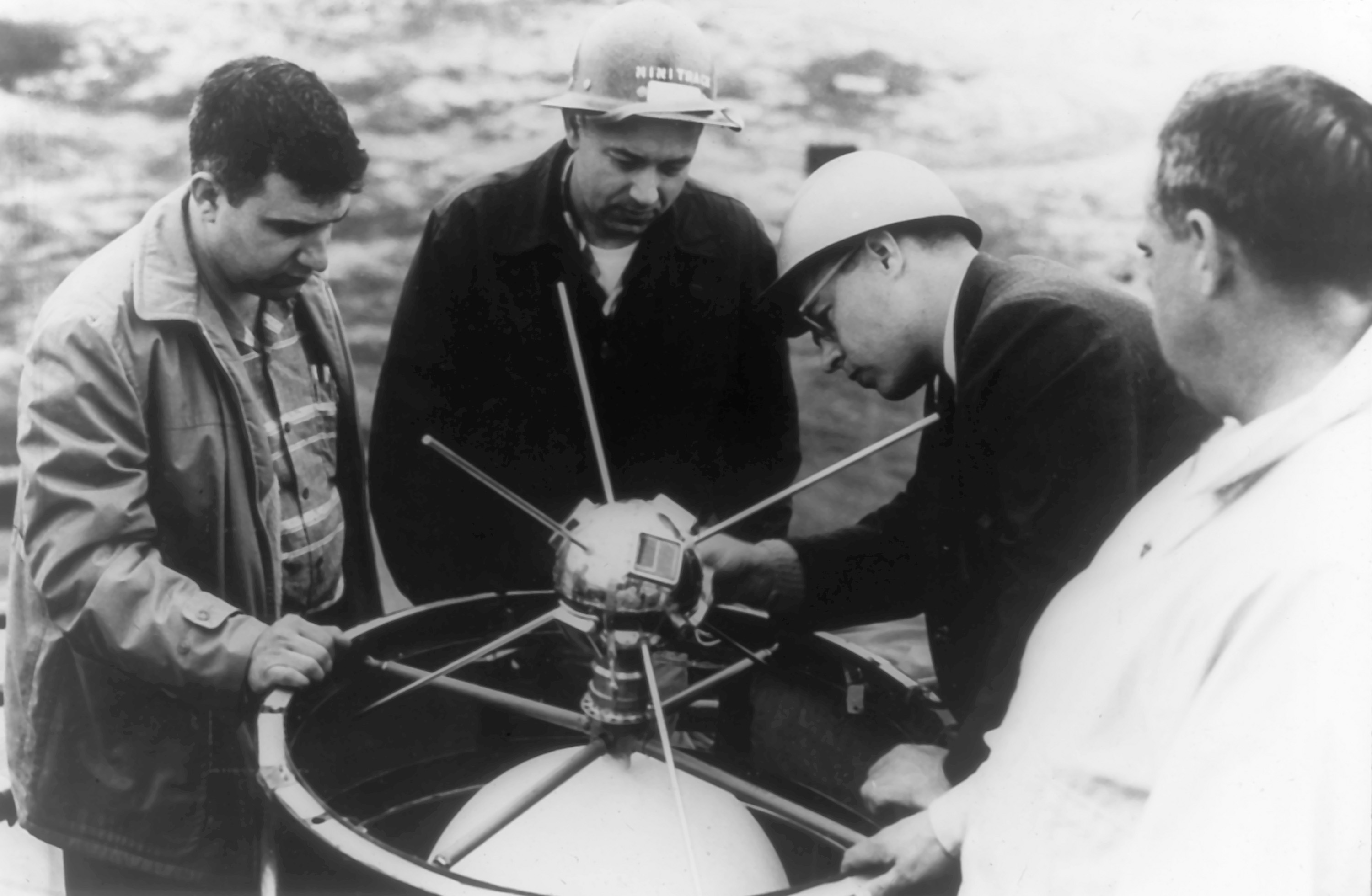 580317-N-NO204-1958. Roger Easton (left) supervises the placement of the Vanguard-1 satellite atop the Viking launch vehicle.