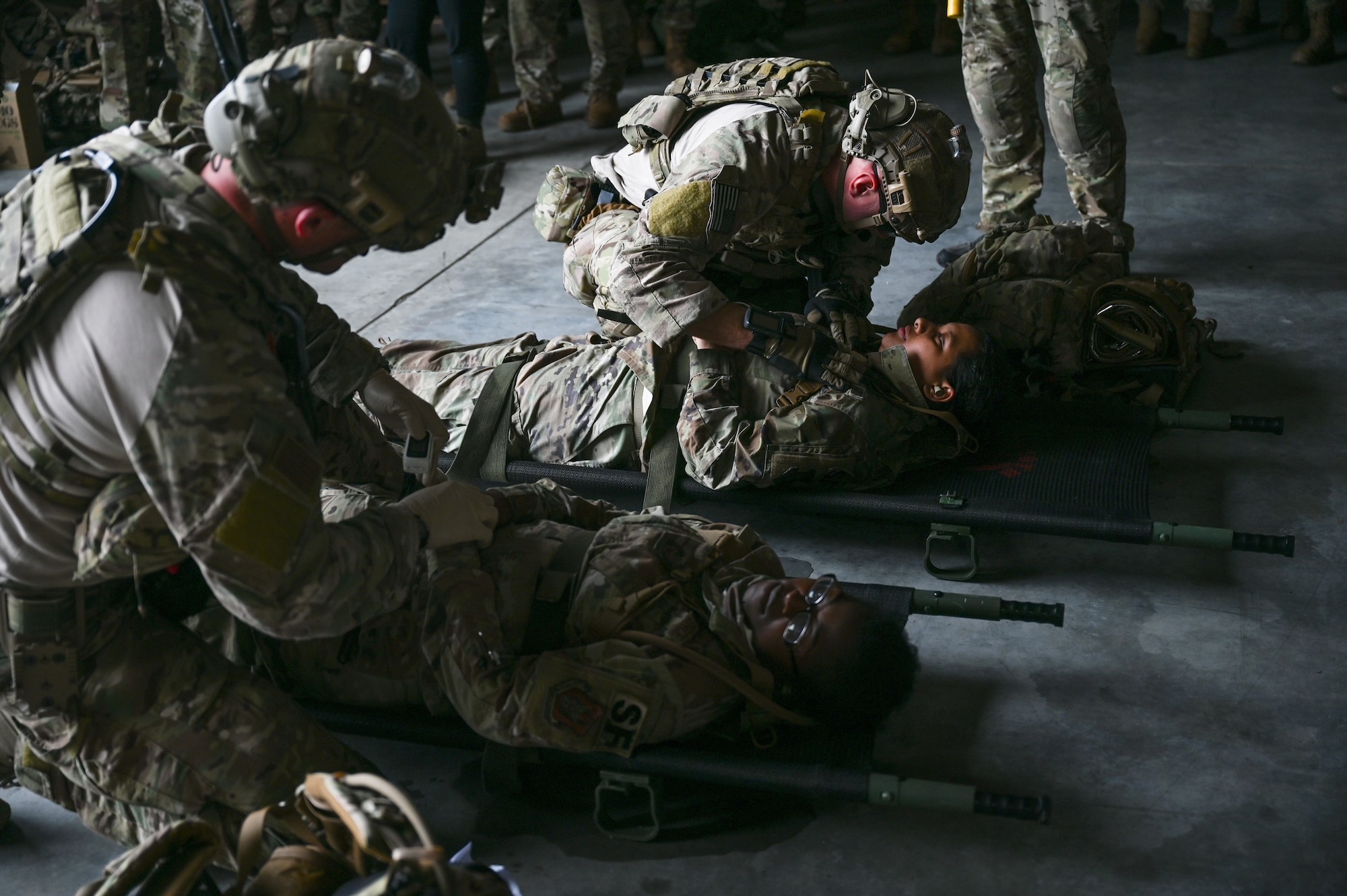 Pararescuemen from the 920th Rescue Wing and 943rd Rescue Group treat Airmen portraying combat injuries during the wing’s FURY HORIZON 22 exercise Feb. 5, 2022. The HORIZON series of wing exercises are held throughout the year at group and wing levels. They bring together the combined knowledge of the entire wing to focus tactics on executing their mission anywhere in the world at a moment’s notice. (U.S. Air Force photo by Capt. Amanda Ling)