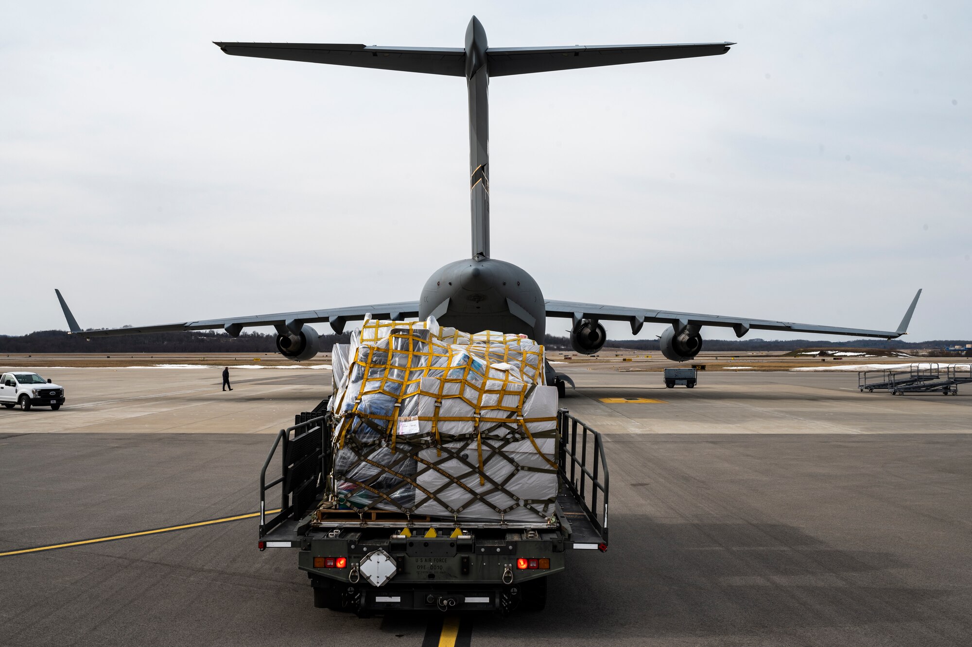 Cargo waits to be loaded onto a C-17 Globemaster III at the Pittsburgh International Airport Air Reserve Station, Pennsylvania, Feb. 16, 2022.