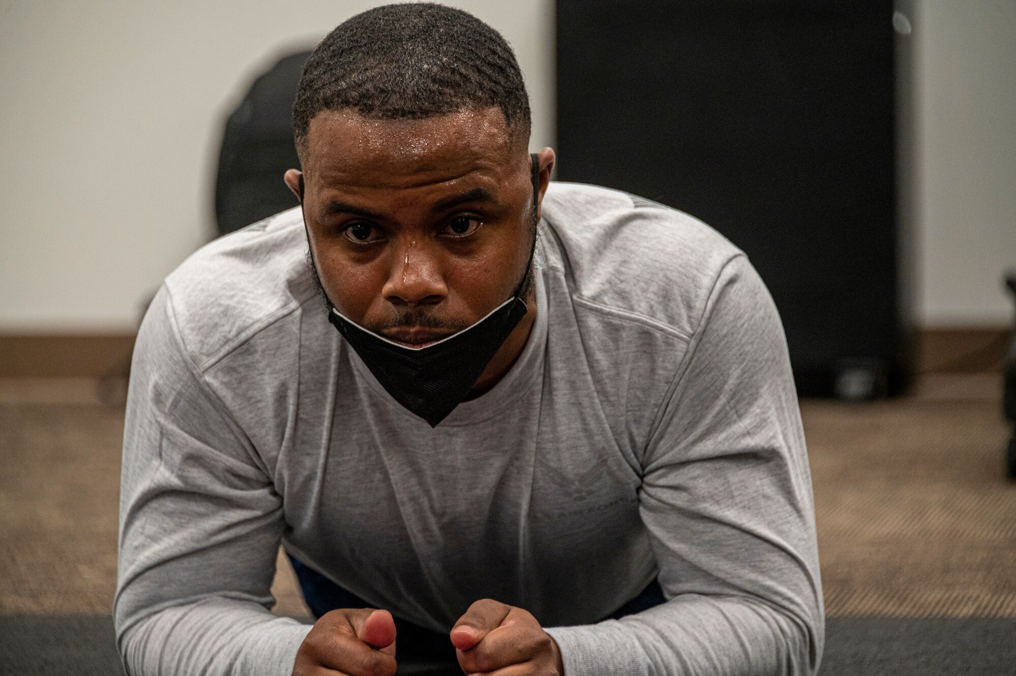 Man holds a plank position.