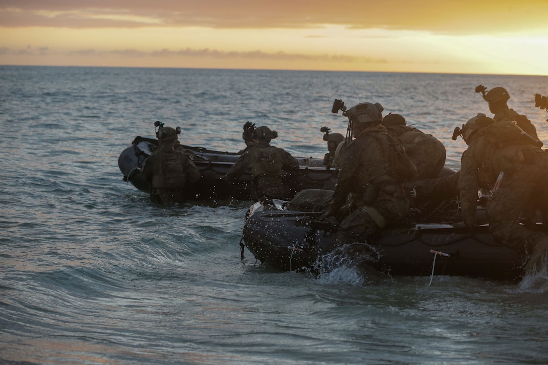 U.S. Marines with the 31st Marine Expeditionary Unit (MEU) launch combat rubber raiding crafts during a bottom-up visit, board, search, and seizure mission to intercept sensitive equipment during Realistic Urban Training Exercise 22.1 (RUTEX) at Joint Base Pearl Harbor-Hickam, Hawaii, Jan 8, 2022. The purpose of the RUTEX is to incorporate the specialized individual and small-unit skills of the MEU and conduct high-intensity, advanced, and complex Marine Air-Ground Task Force operations to prepare MEUs and other designated forces to support the geographic combatant commanders. (U.S. Marine Corps photo by Lance Cpl. Fourmet Gustavsen)