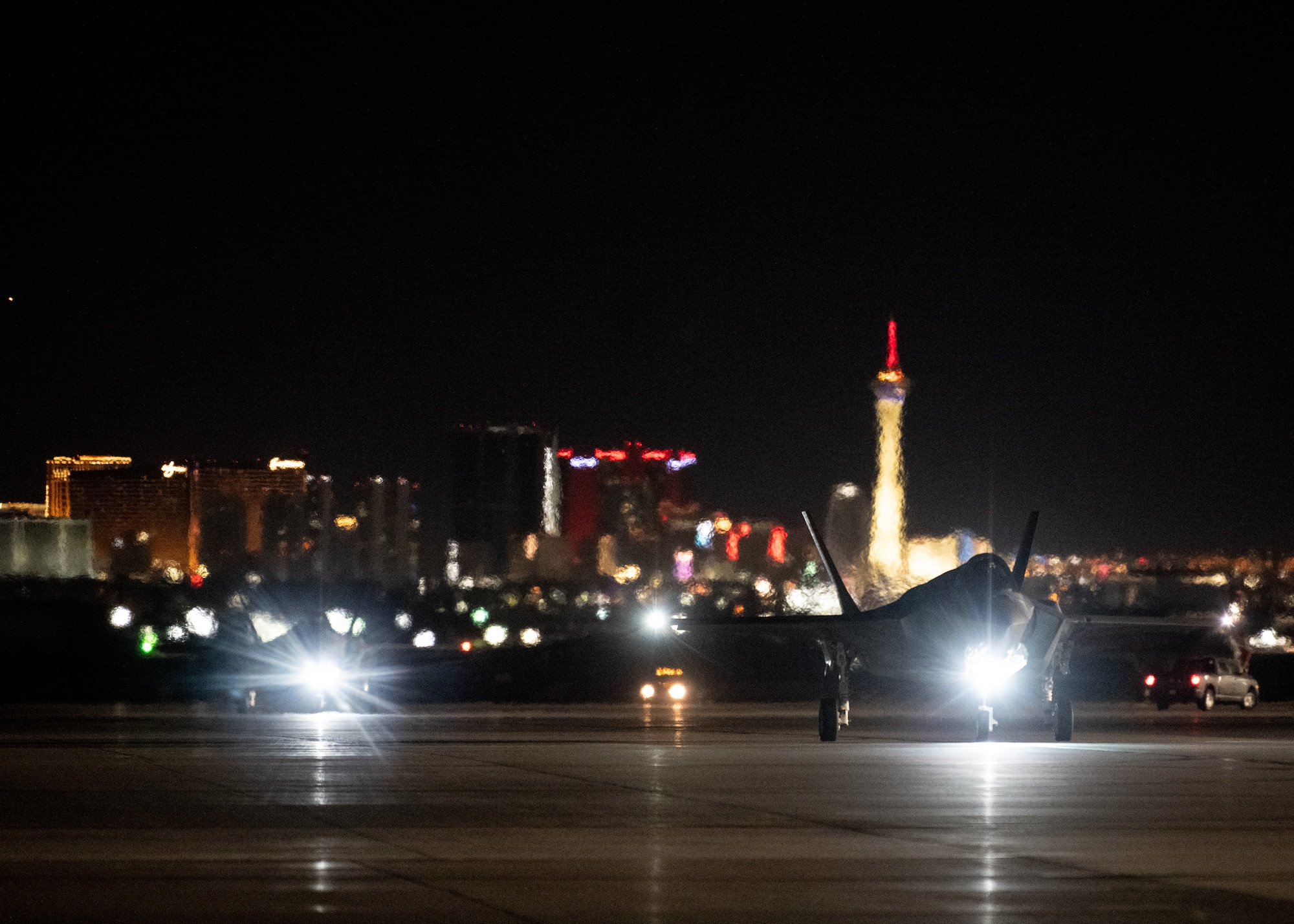 a photo of F-35s taxiing down the Nellis flight line