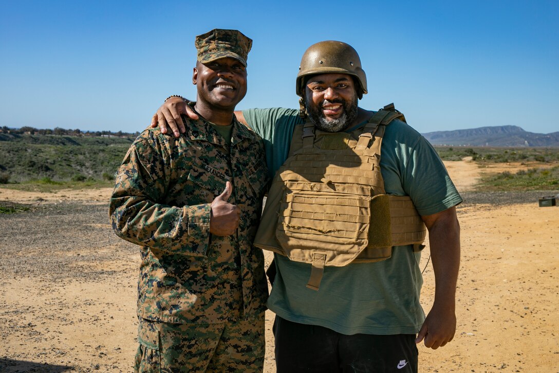 Cedric Collins, a High School Athletics Coach, with Casa Grande Union High School in Arizona, reunites with one of his Students during their the one-week long Educators Workshop on February 10th, 2022 while aboard Marine Corps Base Camp Pendleton, San Diego, California. The Educators’ Workshop is designed to inform high school and college educators about the commitment and benefits of service in the U.S. Marine Corps. Attendees had opportunities to experience what it is like to be a Marine recruit and view a small portion of what new recruits endure. They then return to their place of business with the ability to provide firsthand experience and knowledge to individuals interested in military service. (U.S. Marine Corps photo by Sergeant Anthony Morales)