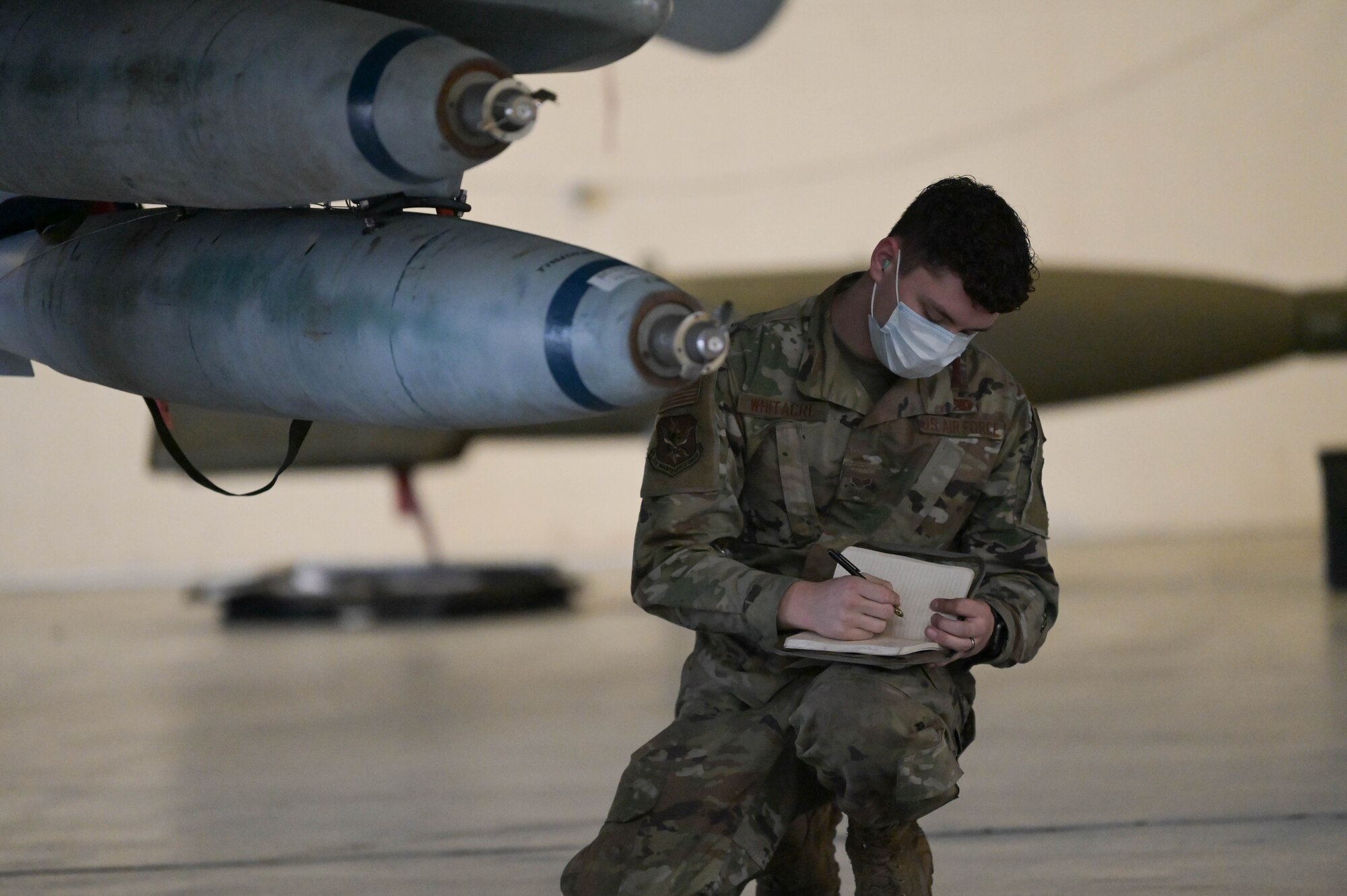 U.S. Air Force Senior Airman Alec Whitacre, 23rd Aircraft Maintenance Group weapons load crew member, evaluates an A-10C Thunderbolt II weapons at Moody Air Force Base, Georgia, Feb. 4, 2022. Annual load crew competitions consist of the best of the best crews striving to be the most time efficient and accurate in loading weapons on an aircraft. (U.S. Air Force photo by Senior Airman Rebeckah Medeiros)
