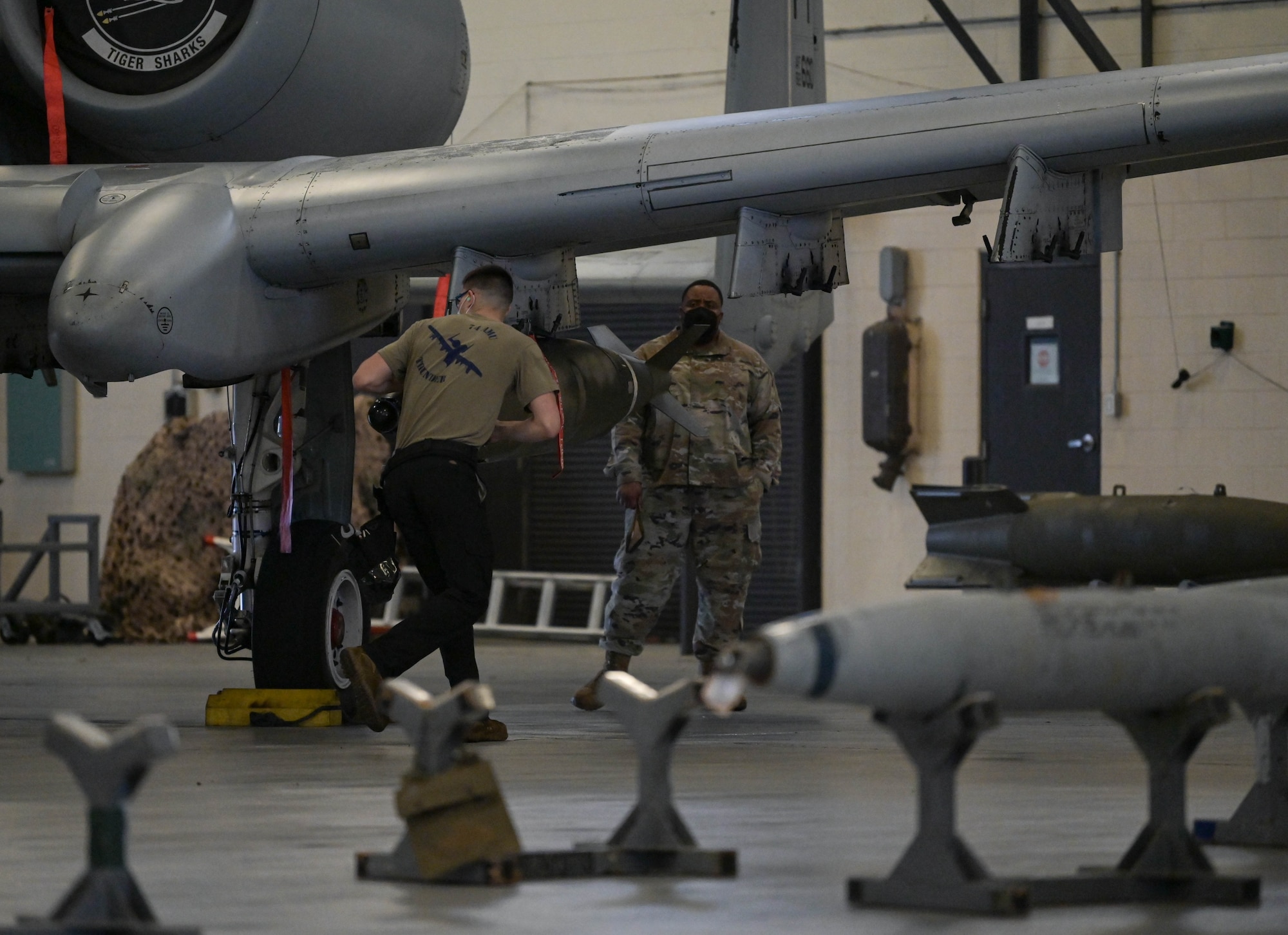 U.S. Air Force Airman 1st Class Steven Mulonet, 74h Fighter Generation Squadron weapons load crew member, runs around an A-10C Thunderbolt II to prepare the aircraft for weapons loading at Moody Air Force Base, Georgia, Feb. 4, 2022. Load crews are required to maintain their proficiency in loading weapons on aircraft safely and efficiently. (U.S. Air Force photo by Senior Airman Rebeckah Medeiros)