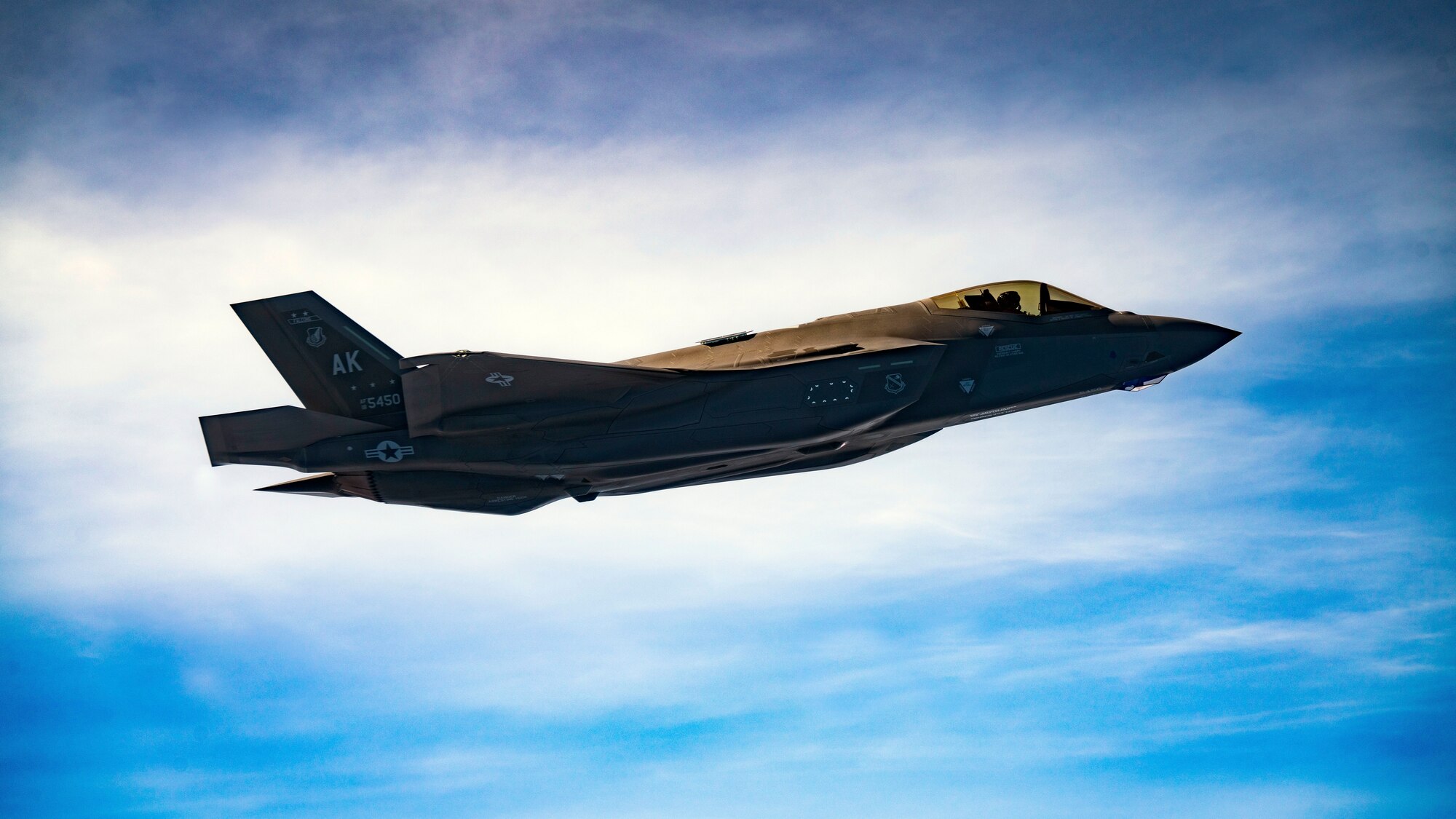 A U.S. Air Force F-35A Lightning II assigned to the 356th Fighter Squadron, Eielson Air Force Base, Alaska, flies alongside of a U.S. Air Force KC-46A Pegasus