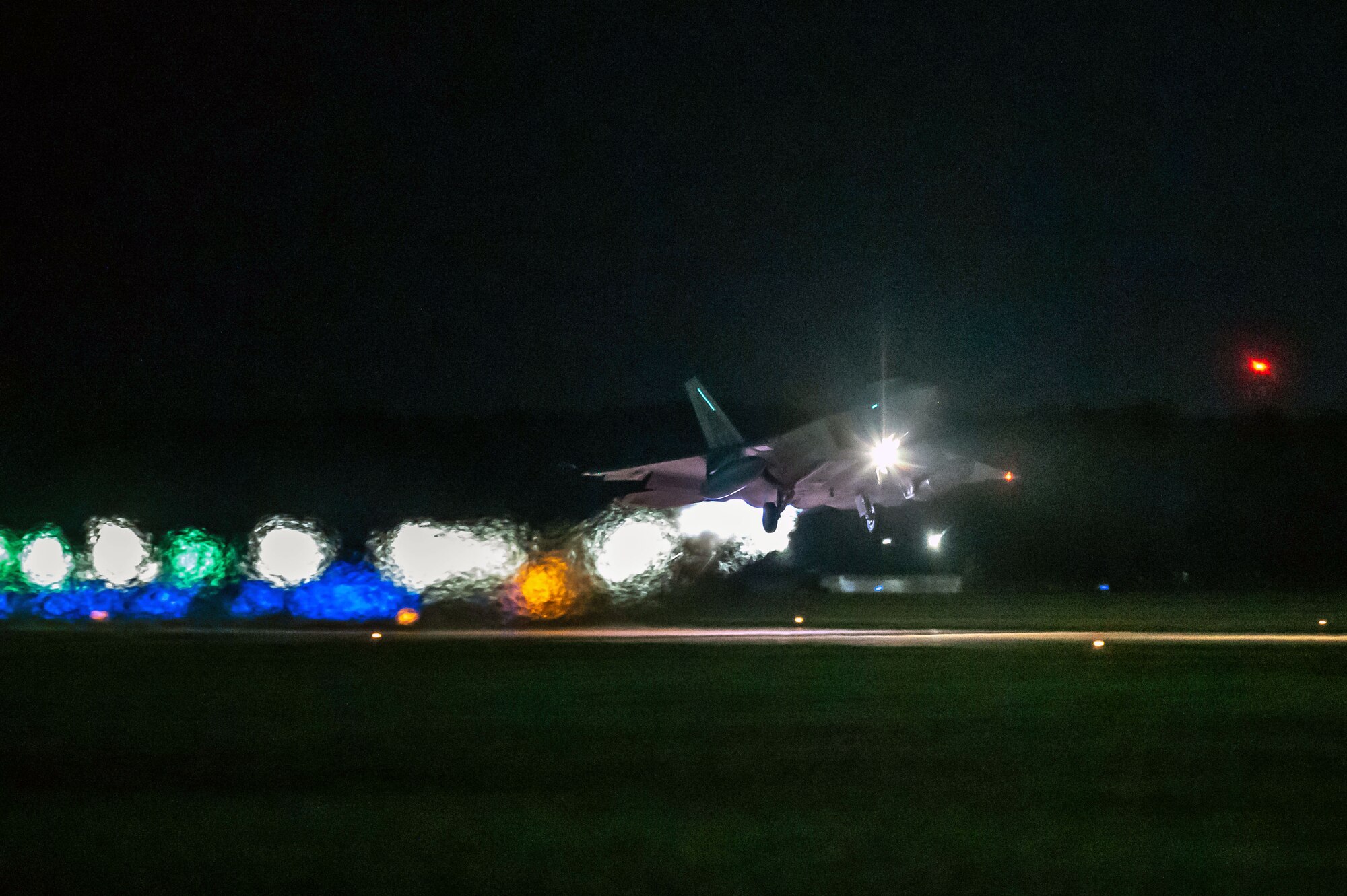 A U.S. Air Force F-22 Raptor, assigned to the 1st Fighter Wing, takes off from the flightline